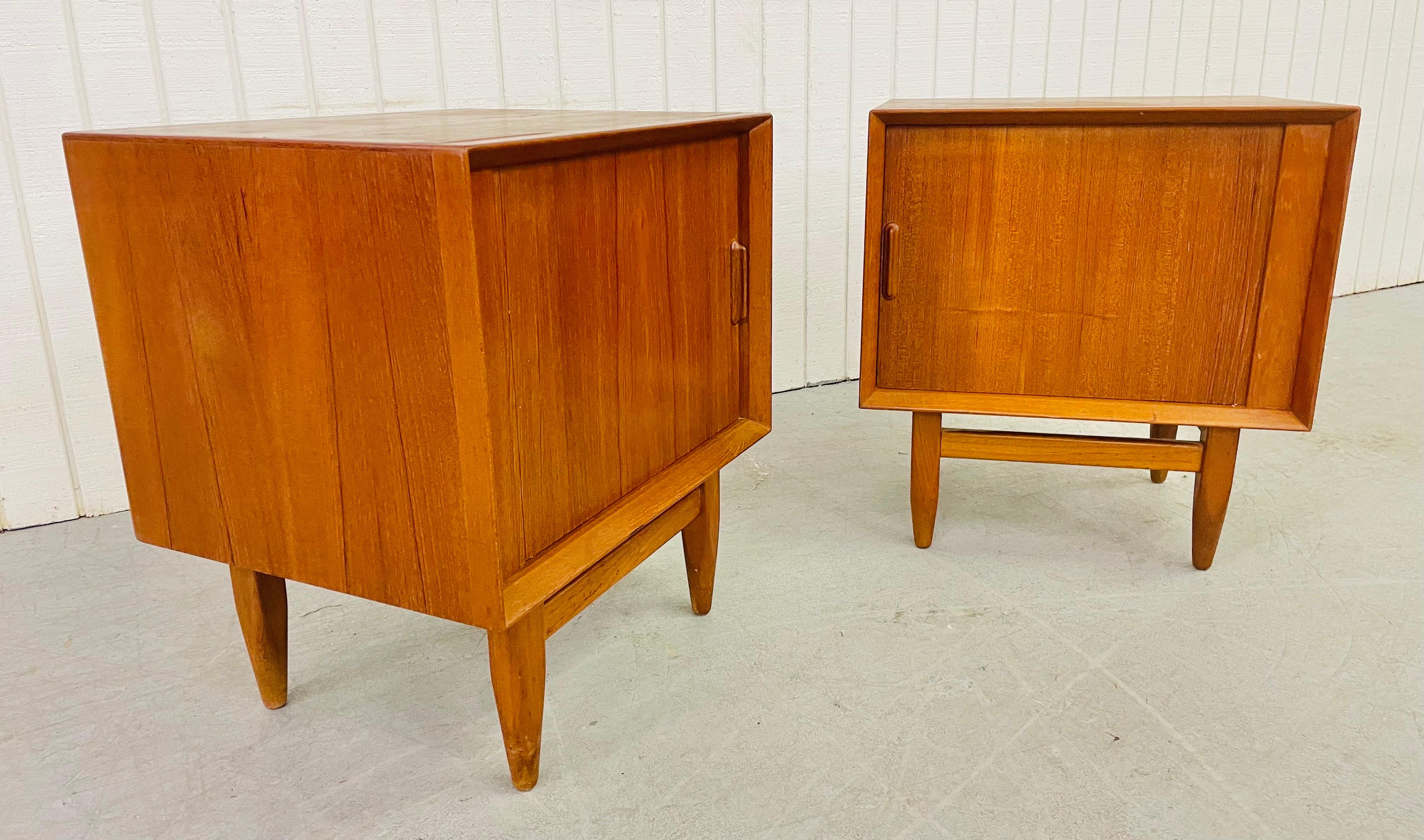 This listing is for an exceptional pair of Mid-Century Danish Modern Falster Teak Tambour nightstands. Featuring a sliding tambour door, a single drawer, a shelf, and a beautiful teak finish.