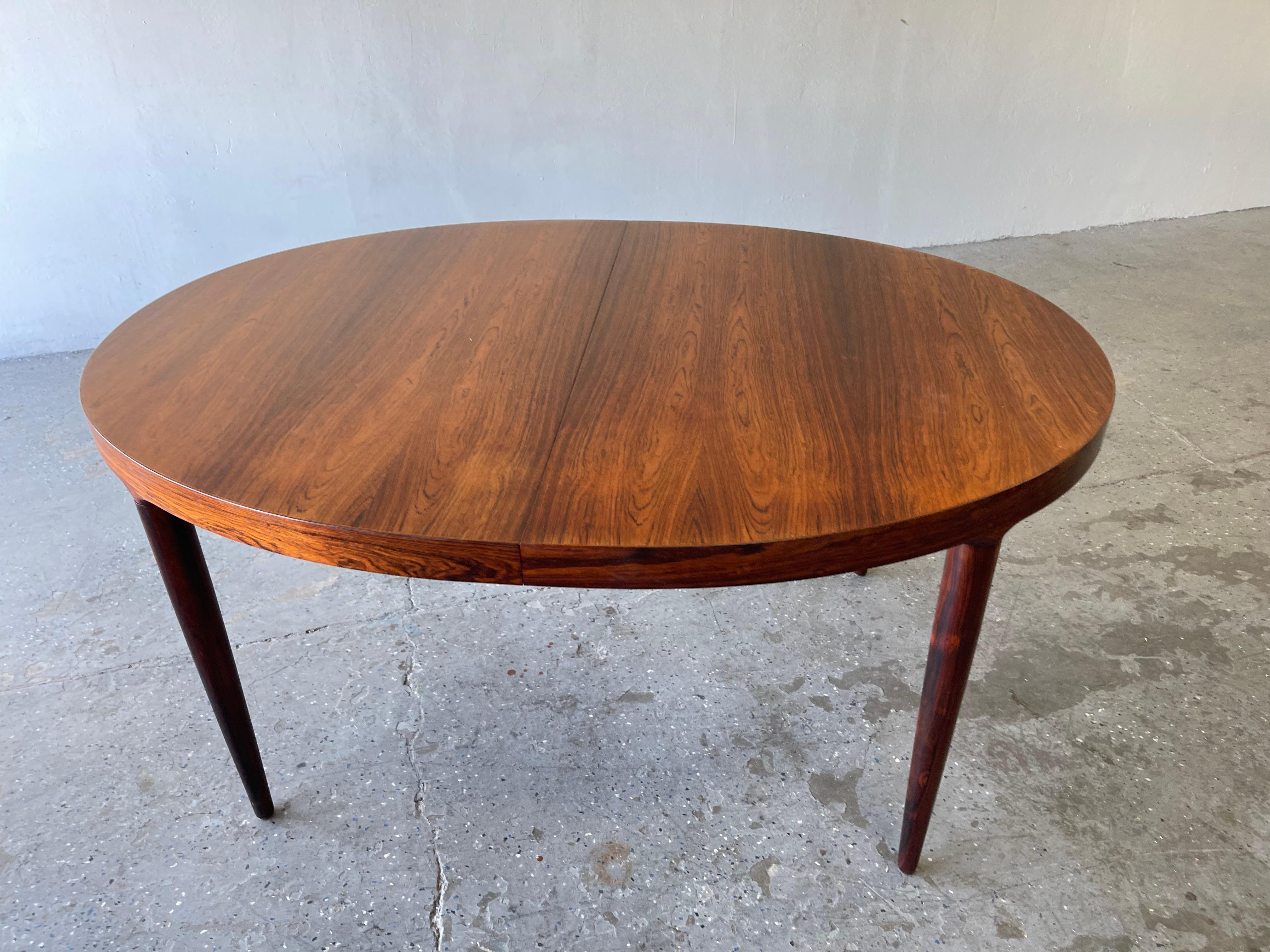 Danish Modern Moreddi Rosewood dining table with two leafs.

Beautiful Rosewood dining table by Moreddi of Denmark designed by Harry Ostergaard. The rosewood grain is just stunning. Photos tell the whole story. Very rare table don’t miss