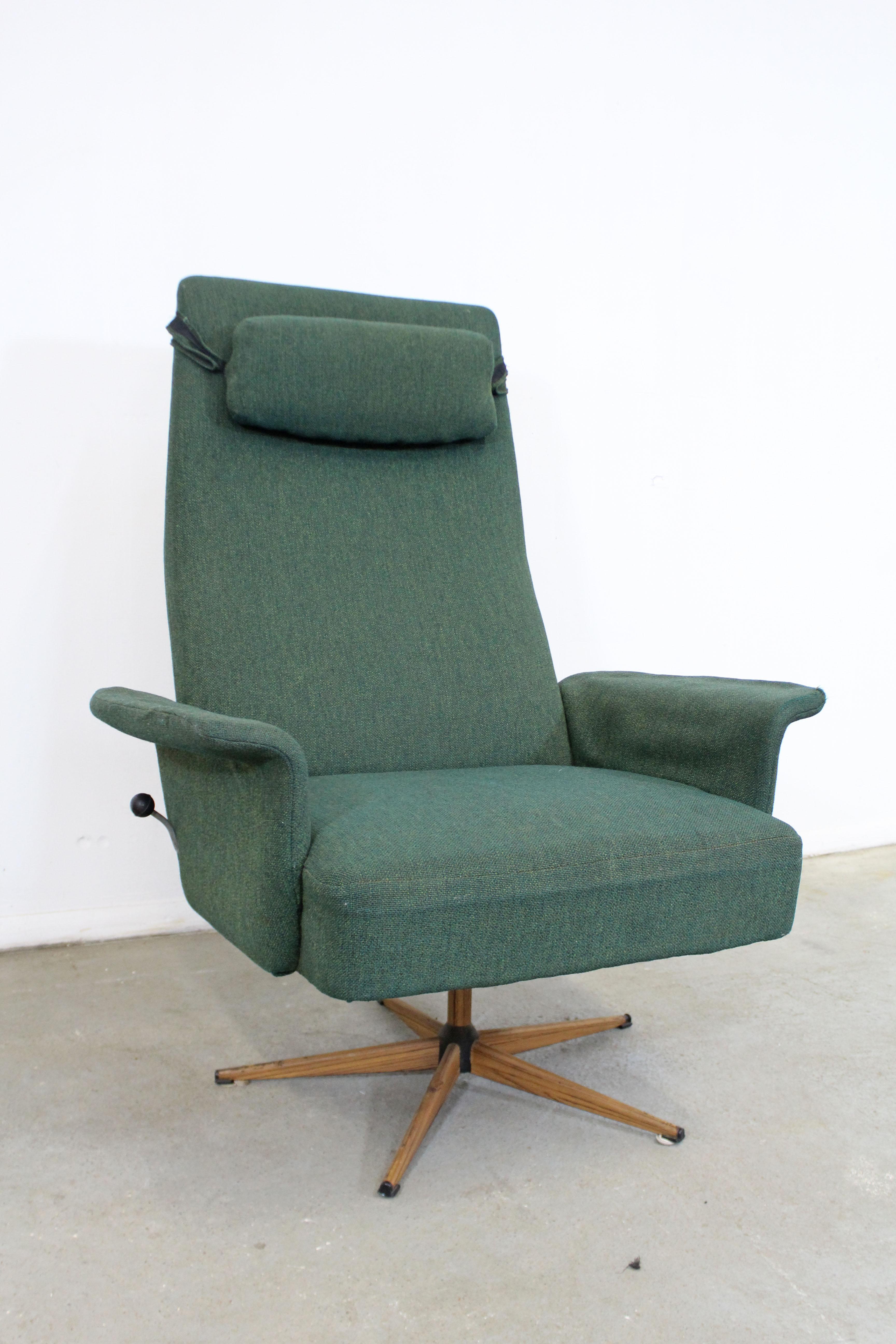 What a find. Offered is a Danish modern style lounge chair with green upholstery that swivels and rocks. Has a removable headrest and side lever to lock the chair in place. It is structurally sound condition showing age wear on upholstery and legs
