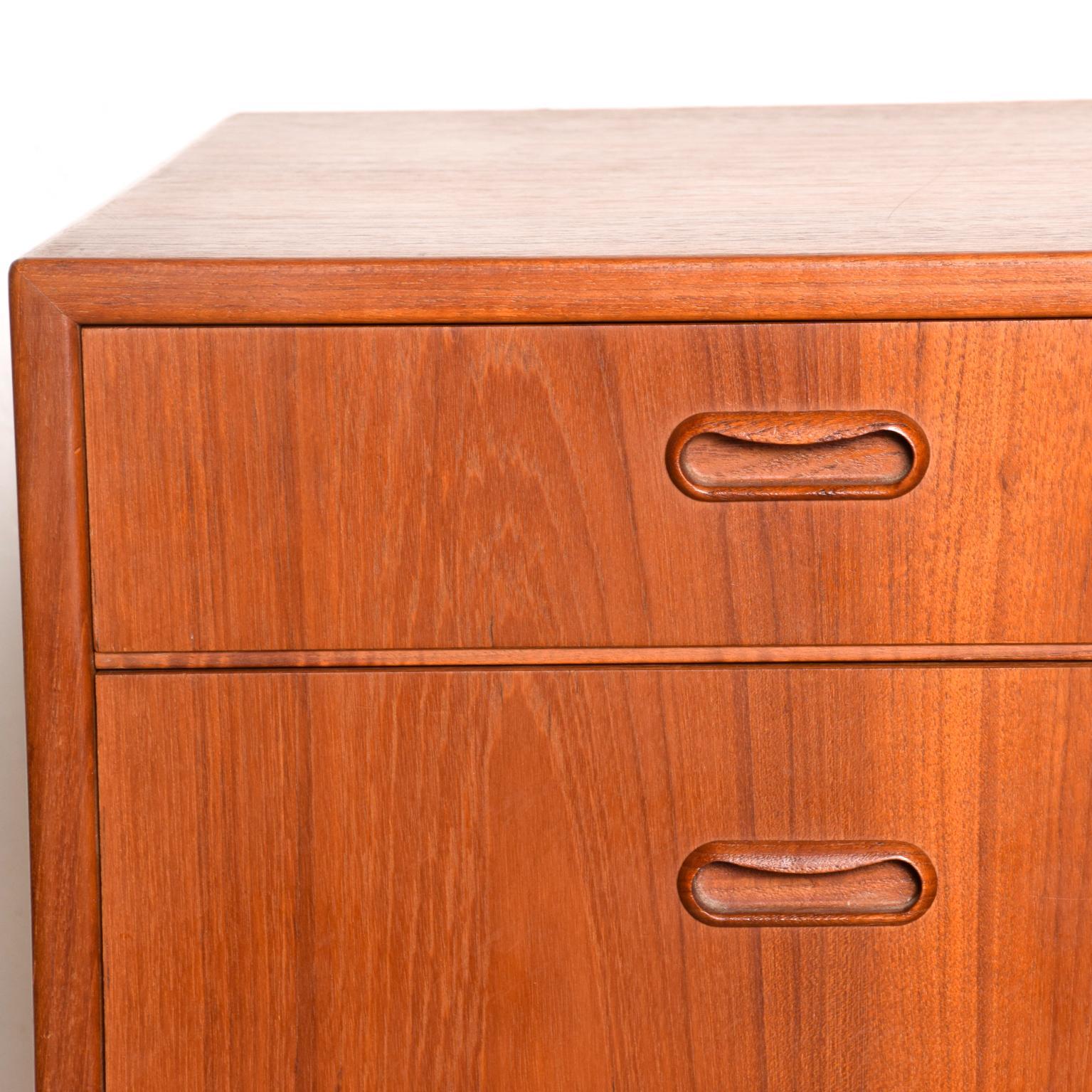For your consideration, a highboy dresser-chest of drawers made in Denmark by FALSTER. Constructed with teak wood. All drawers are constructed with double dovetail joints and are open-close with ease. Stamped with FALSTER label in the top drawer.