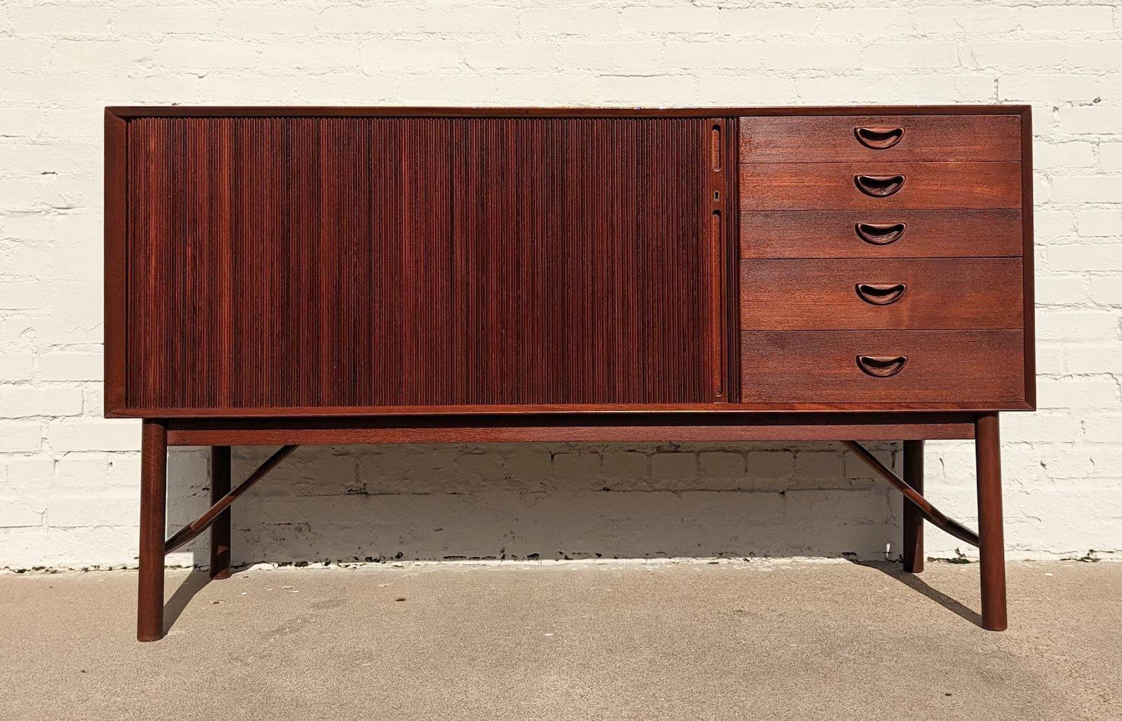 Mid Century Danish Modern Hvidt & Molgaard Tambour Door Teak Cabinet

Above average vintage condition and structurally sound. Has some expected slight finish wear and scratching. Back right edge has a 2
