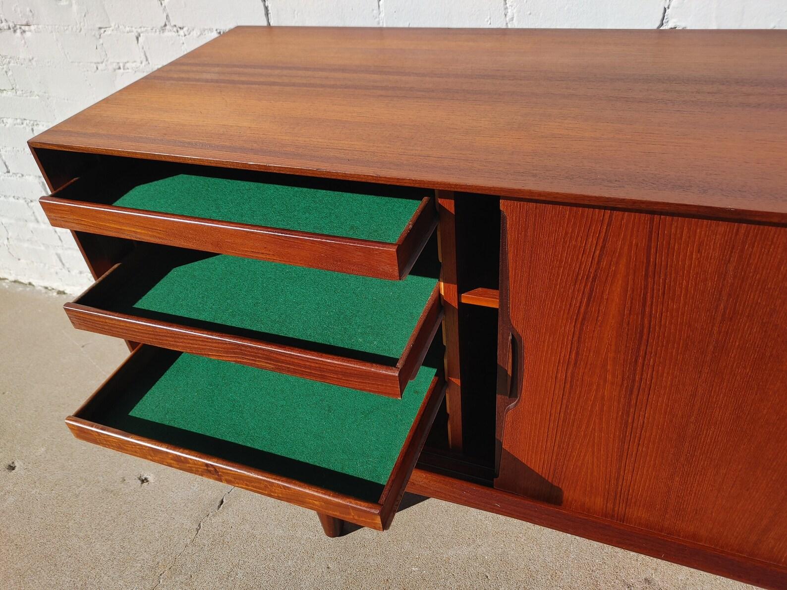 Mid Century Danish Modern Knud Nielson Sideboard

Above average vintage condition and structurally sound. Has some expected slight finish wear and scratching. Outdoor listing pictures might appear slightly darker or more red than the item does