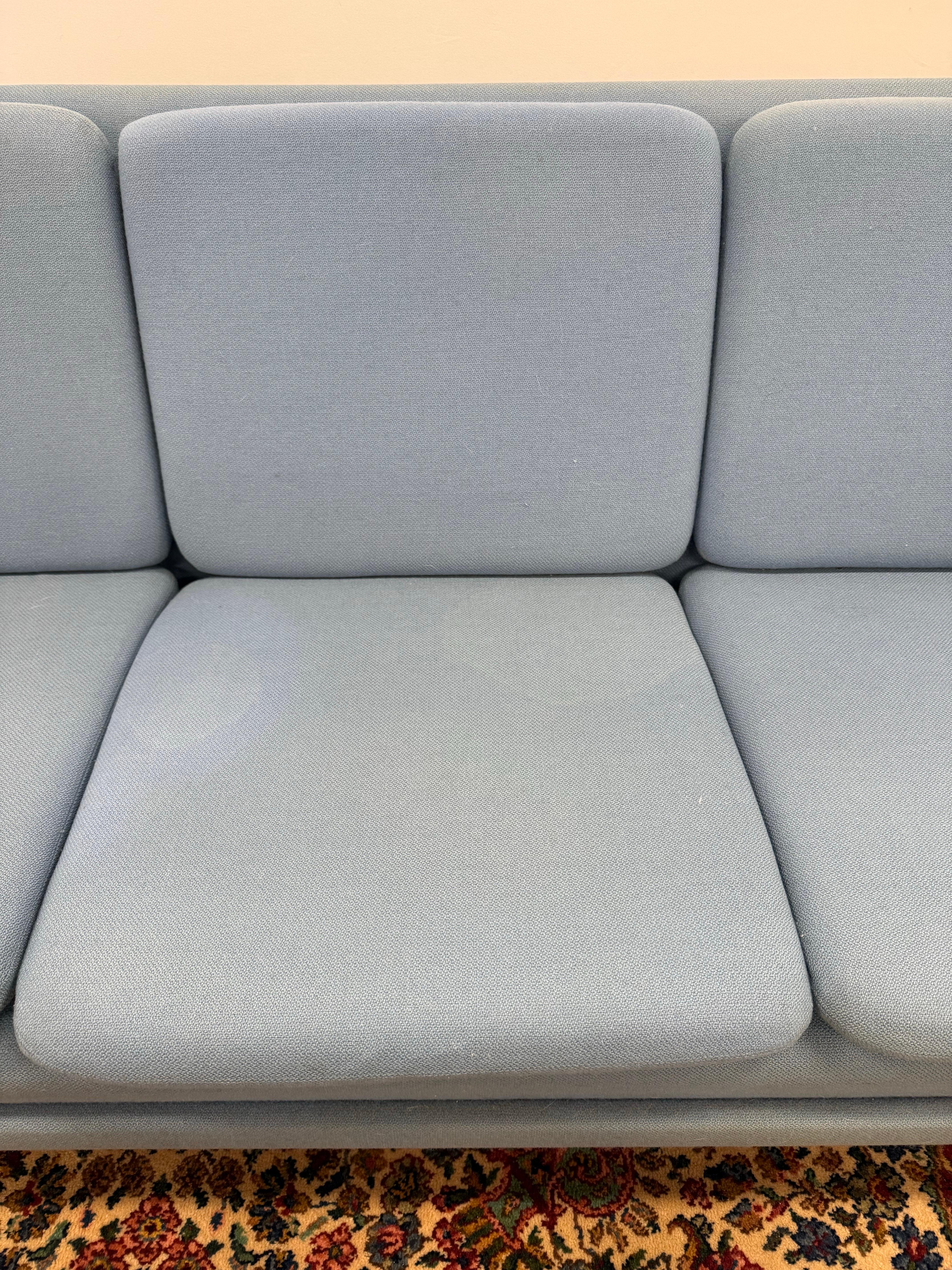 Crafted by Folke Ohlsson for Fritz Hansen, this sofa captures the essence of midcentury style, featuring supple curves and understated sophistication.
Upholstered in a serene blue wool.
Secure this rare Midcentury Danish Modern Sofa—an investment in