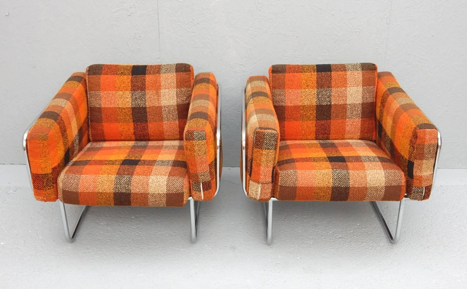 Tubular chrome lounge chairs designed by Hans Eichenberger of Denmark, circa 1960.
Gorgeous original fat plaid wool upholstery in bold bright colors.
Very comfortable chairs.
 