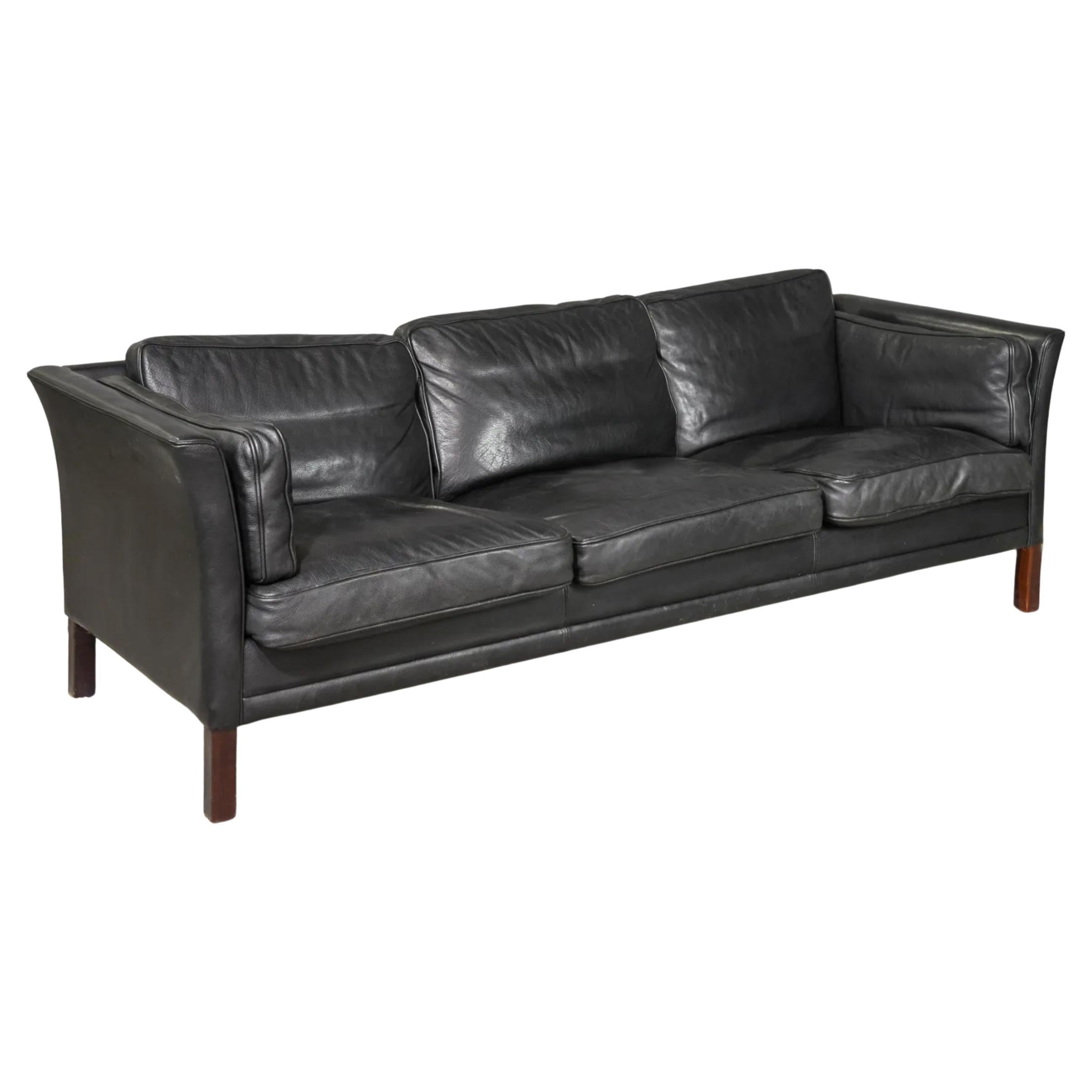 Curved arm Low Mid century Danish modern Black leather 3 seat sofa with rosewood wood legs. Style of Børge Mogensen. Beautiful thick Black leather is soft and shows signs of use but broken in nicely. Great Danish Modern sofa with curved arms. Good