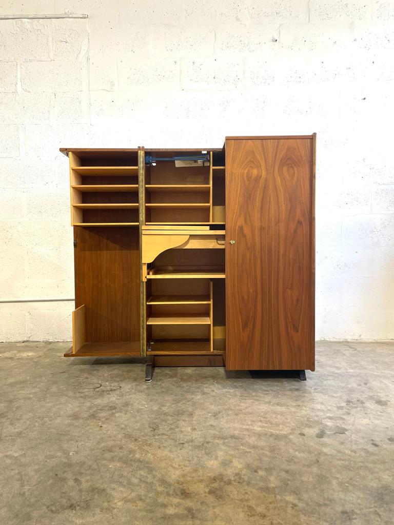 Mid Century “Magic Box” Desk in Teak. Designed by Swiss Mummenthaler and Meier. No key. Original lamp. 
Open measurements - 64