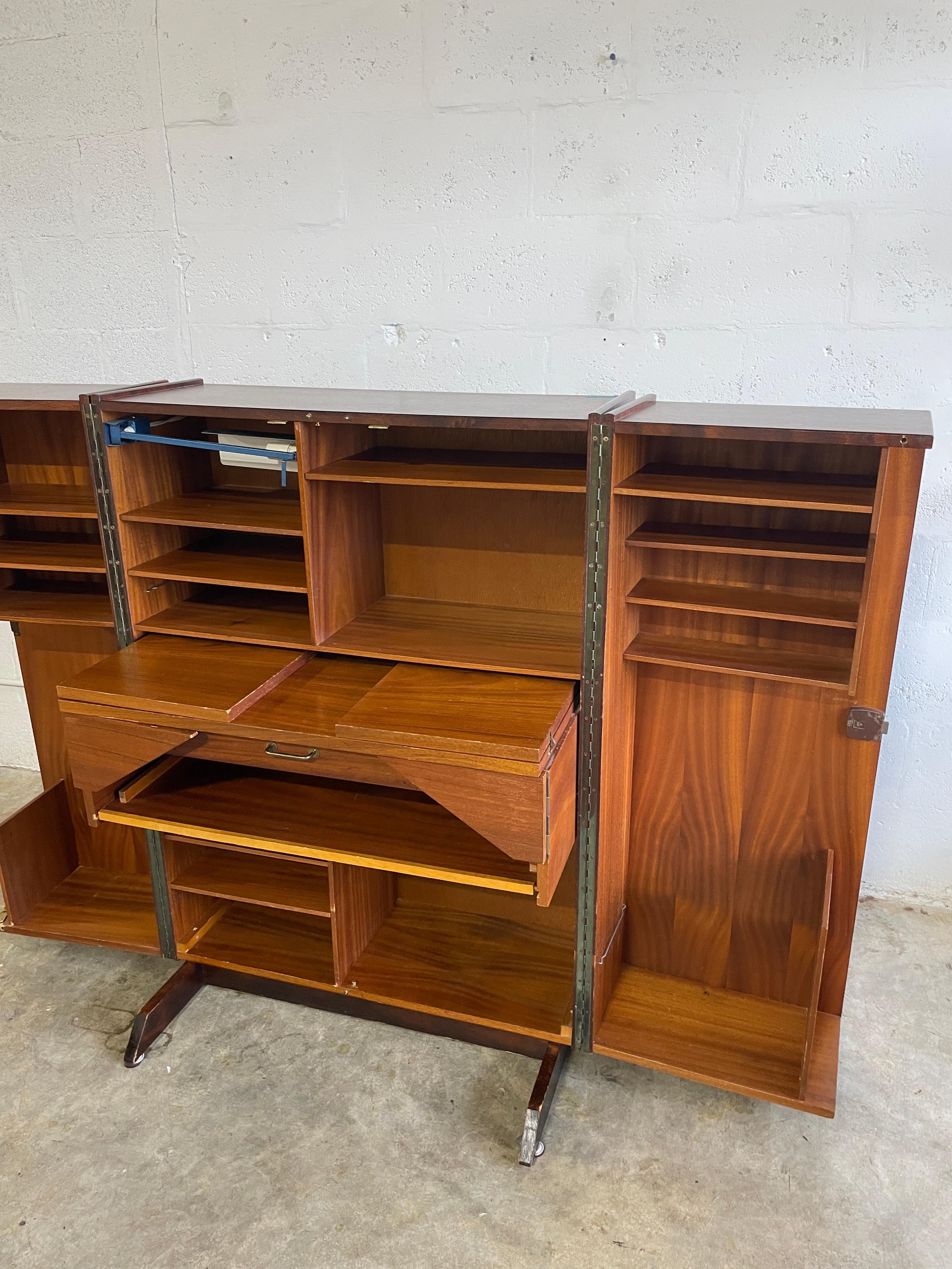 “Magic Box” Desk by Mummenthaler and Meier. This amazing piece closes completely into a box and opens up to display several storage compartments and shelving. Comes with one original key and original lamp (no bulb). 