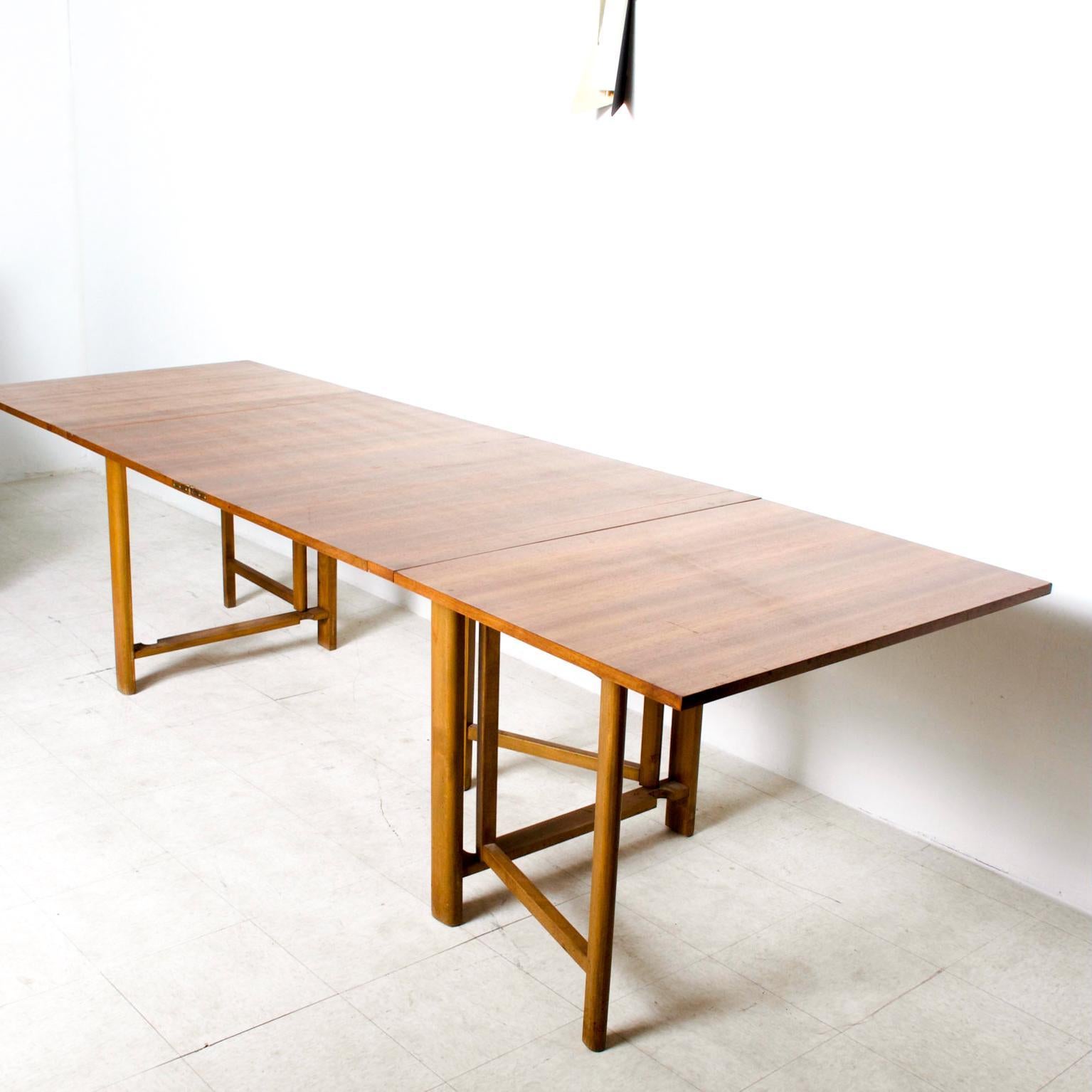 We are pleased to offer for your consideration a Maria Table in Teak. Made in Denmark. By Bruno Mathsson. The table can be folded into multiple configurations. 

Dimensions: 35 1/2