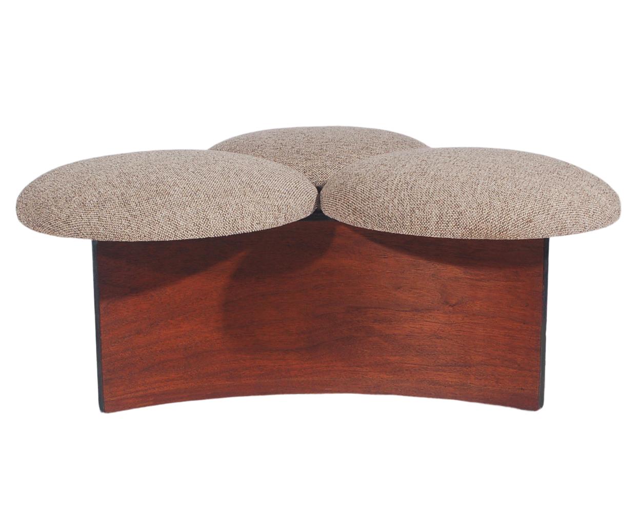 A unique piece probably from Scandinavia, circa 1960s. It consists of a walnut stained bentwood base with three circular cushions. The cushions were recently recovered in a neutral tweed fabric.