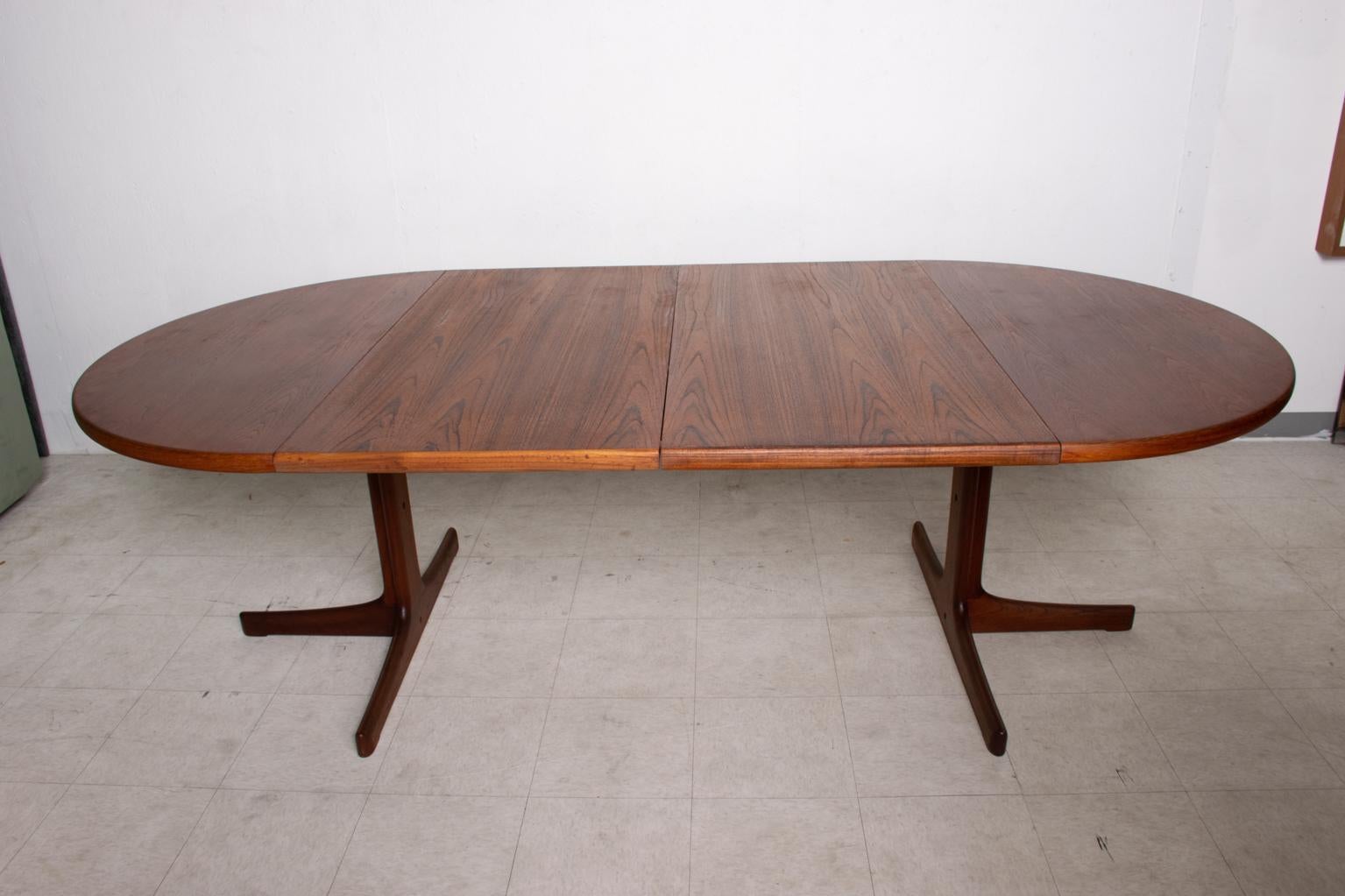 oval teak dining table