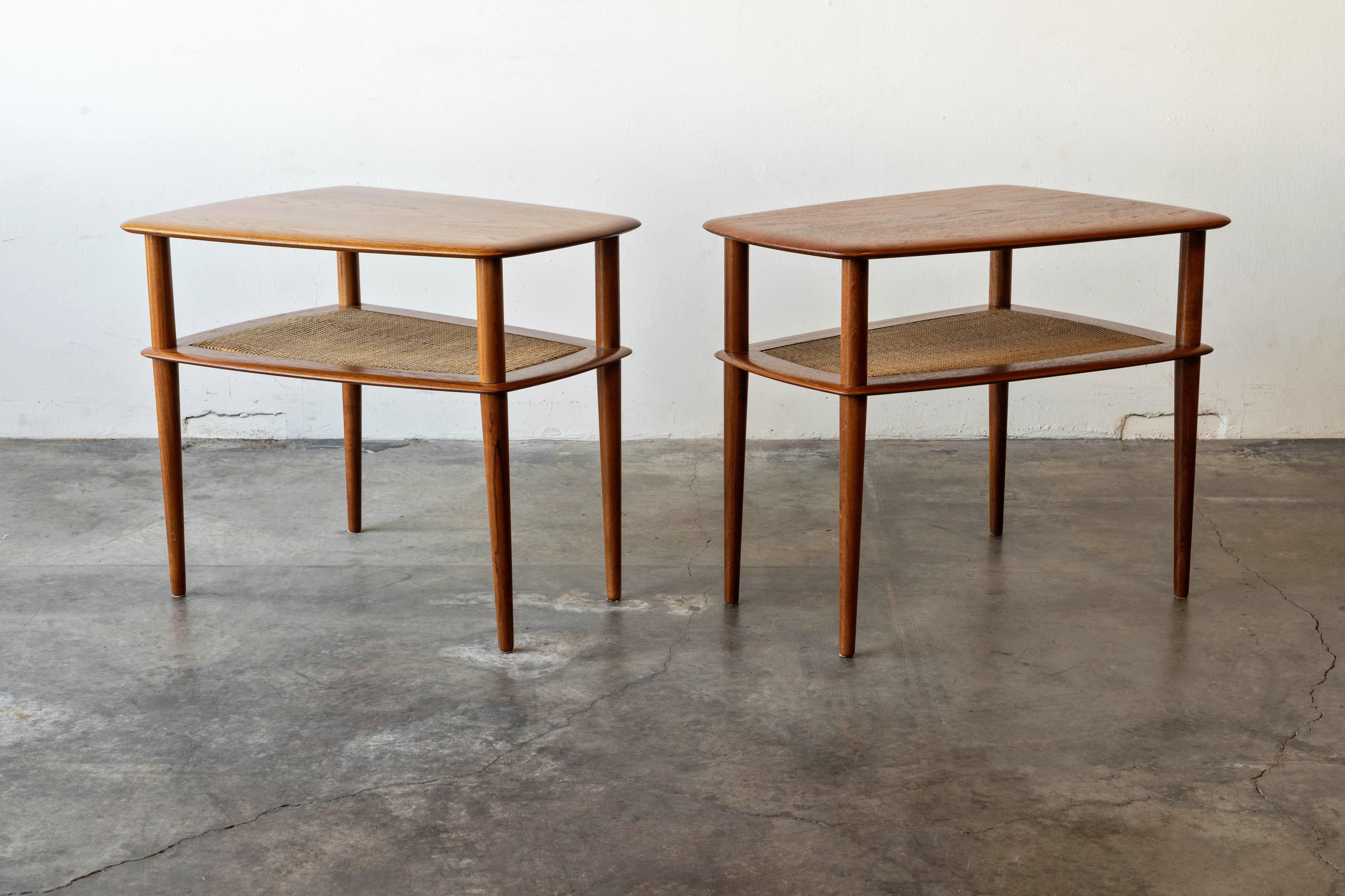 Danish Modern Pair of Peter Hvidt Solid Teak & Cane Side Tables 

This side table set was designed in 1956 by Peter Hvidt and Orla Mølgaard Nielsen for France and Daverkosen. The solid teak top and tapered legs boast a vivid grain softened by the