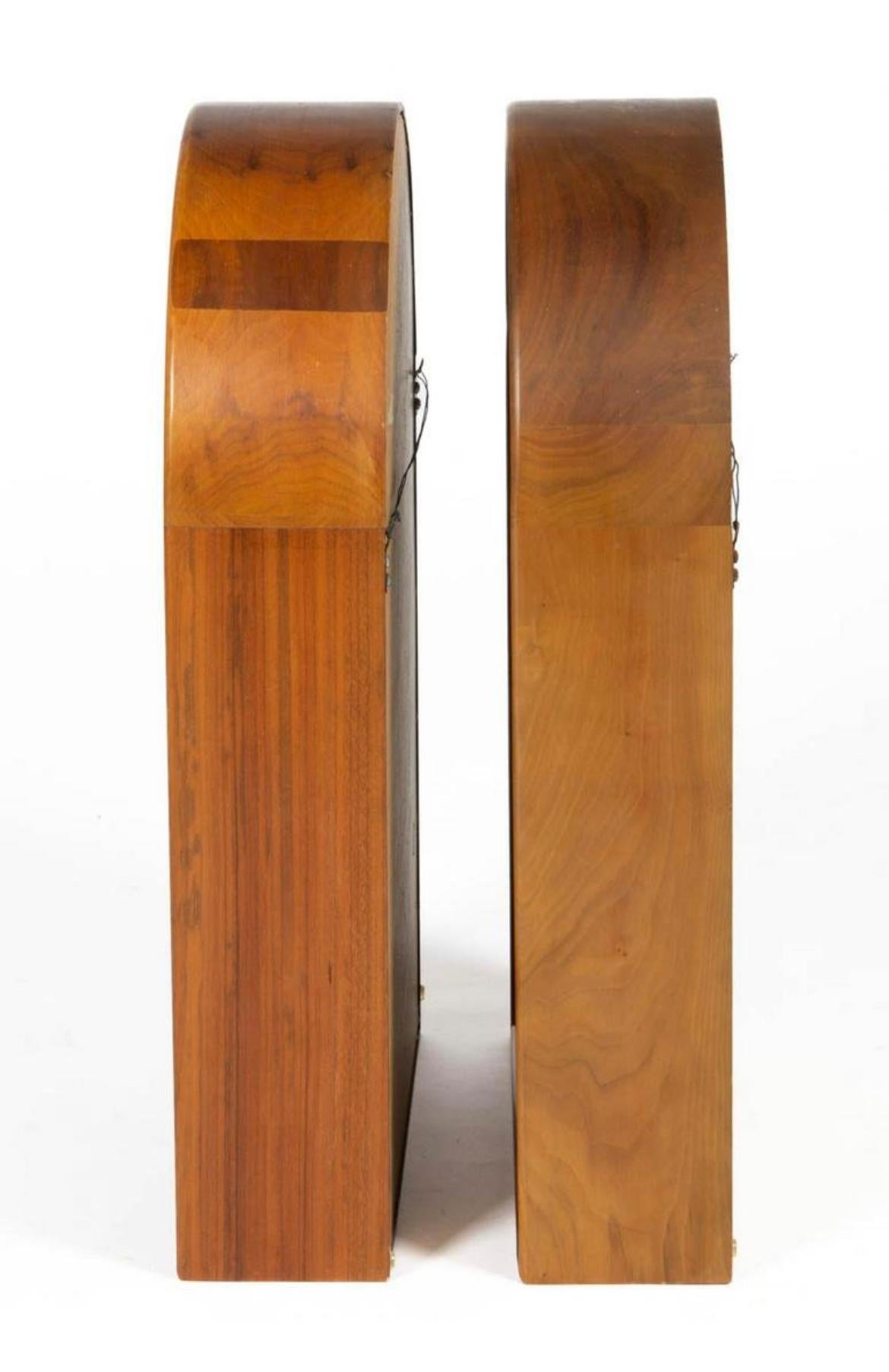 Pair of beautiful mid century Danish modern teak small display wall shelves - arched form with three fixed shelves. Wired to hang on wall vertically. Sold as a set of (2). Located in Brooklyn NYC.

Each unit Measures 26 1/2