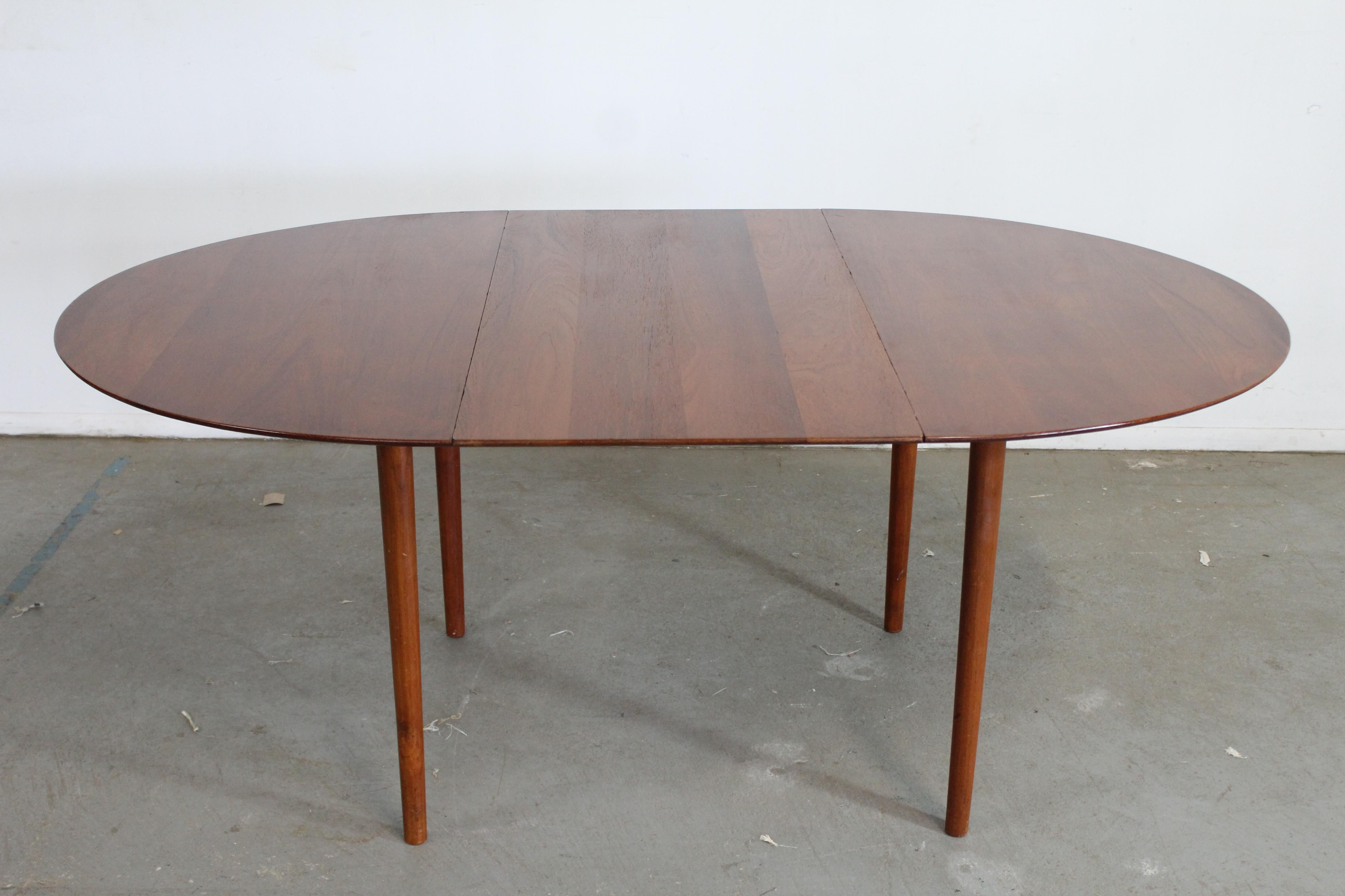 Mid-Century Danish Modern Peter Hdvit teak oval dining table w 1 Extension

Offered is a vintage mid-century modern dining table. The table was designed by Peter Hdvit for Sorborg. Referred to as model 311. The table is made of teak and features 1