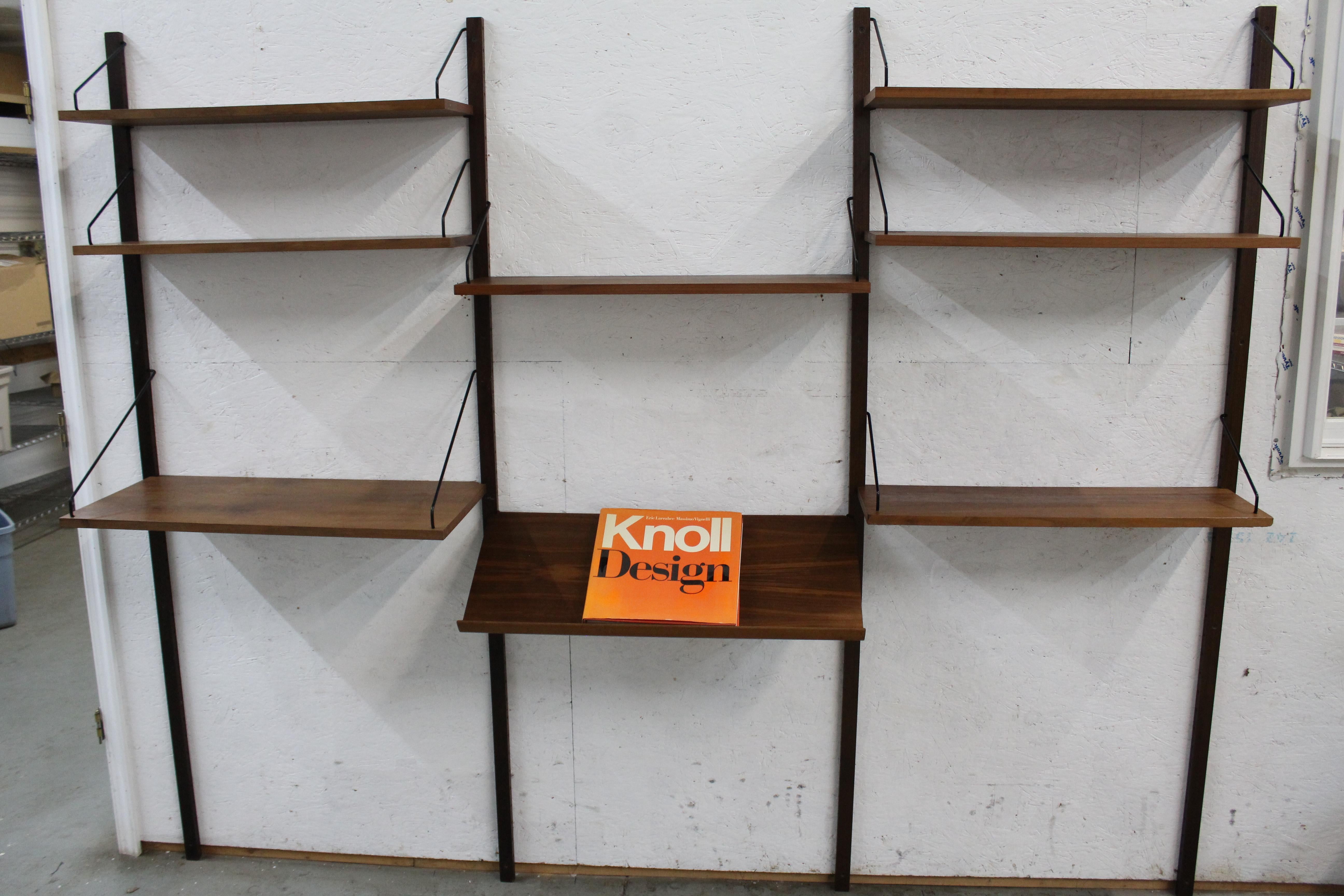 Mid-Century Danish Modern  Poul Cadovius for Cado Denmark Teak Wall Unit

Offered is a Danish modern teak wall unit that was designed by Poul Cadovius for Cado Denmark in the 1960s. This versatile unit features ample display and shelving. The unit