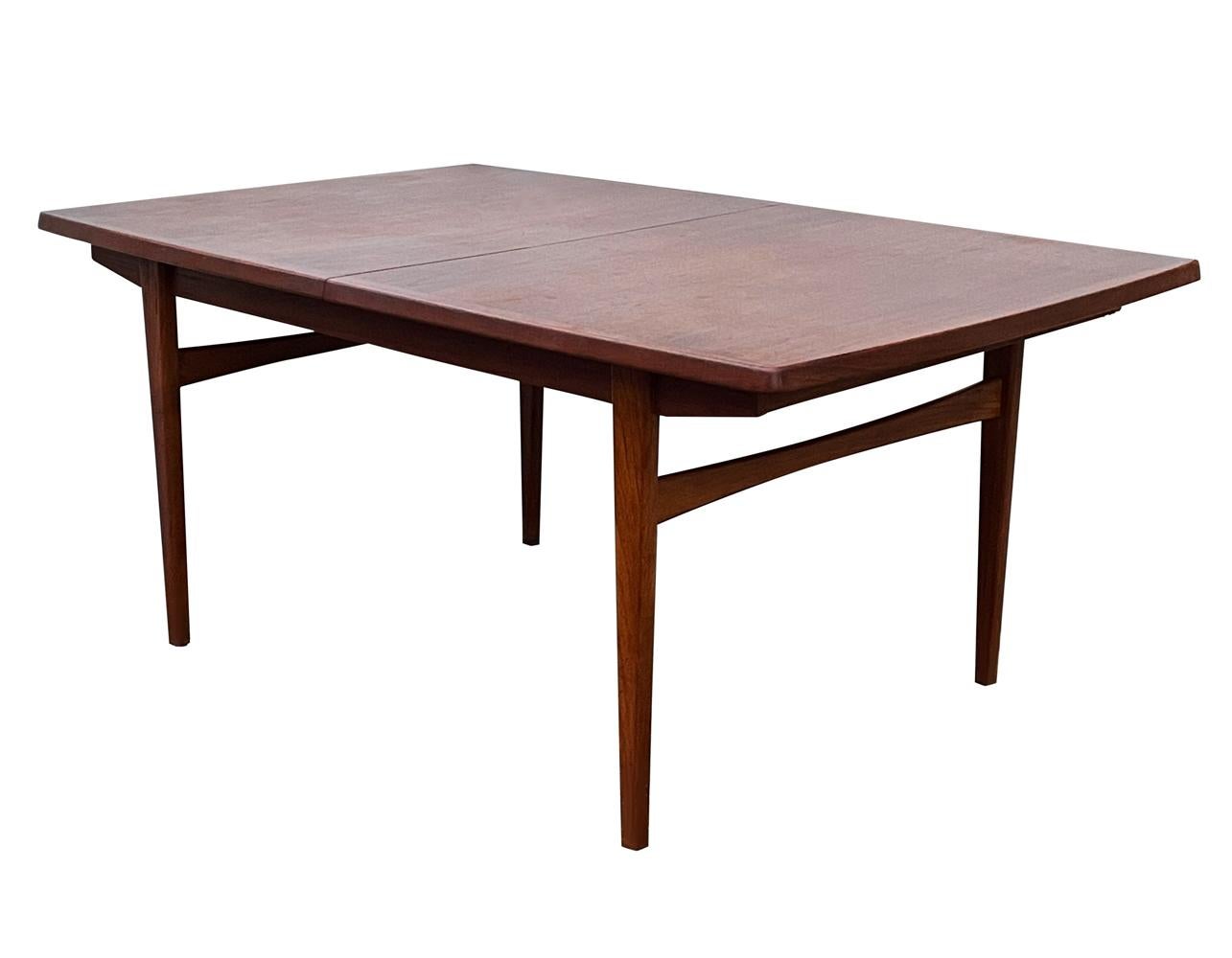 Scandinavian Modern Mid Century Danish Modern Rectangular Dining Table in Teak with 2 Extension Leaf