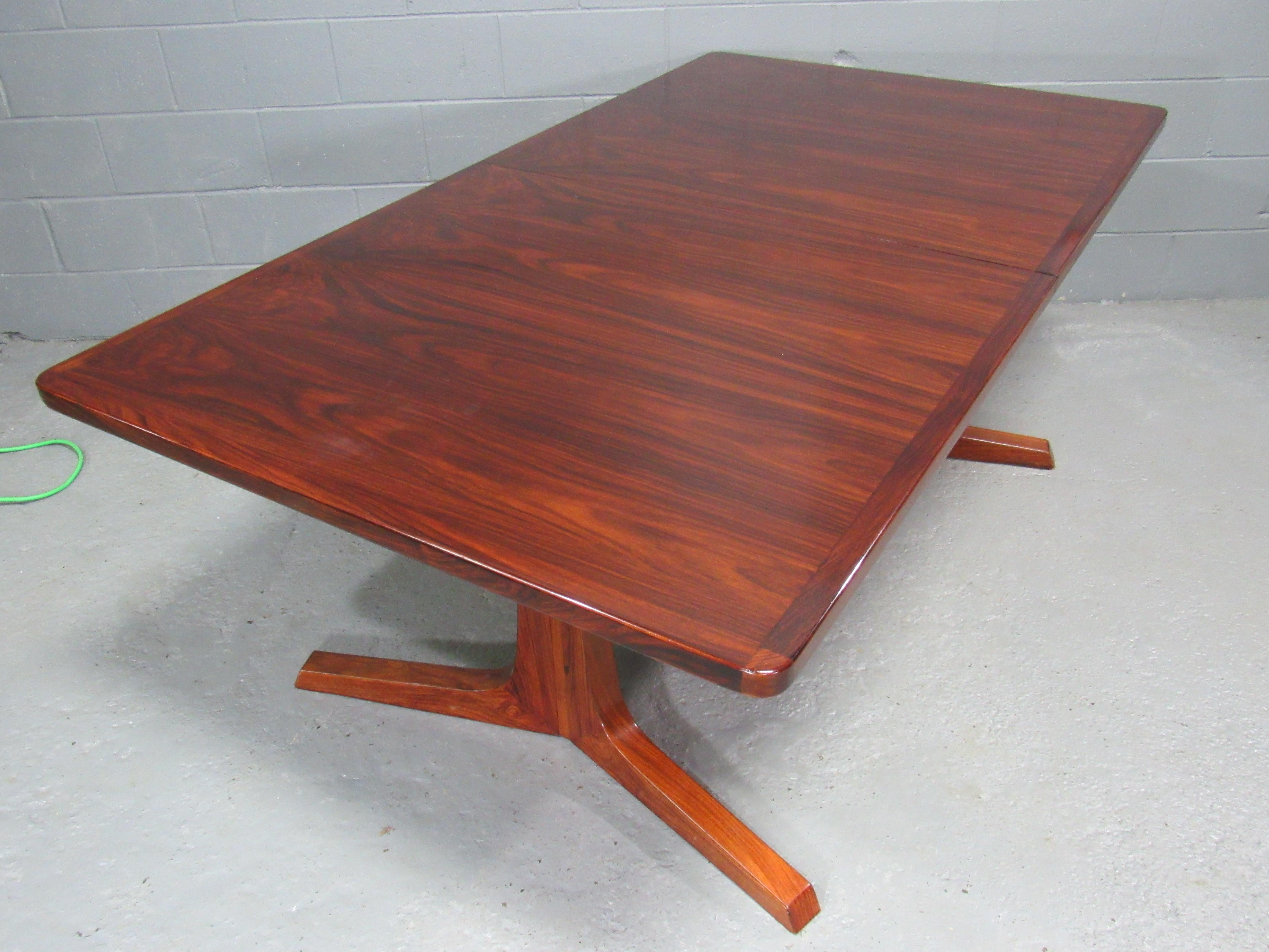Mid-Century Danish Modern Rosewood Extension Dining Table by Gudme Mobelfabrik. Leaf self stores under table top.  One 19 1/4 in. leaf included.