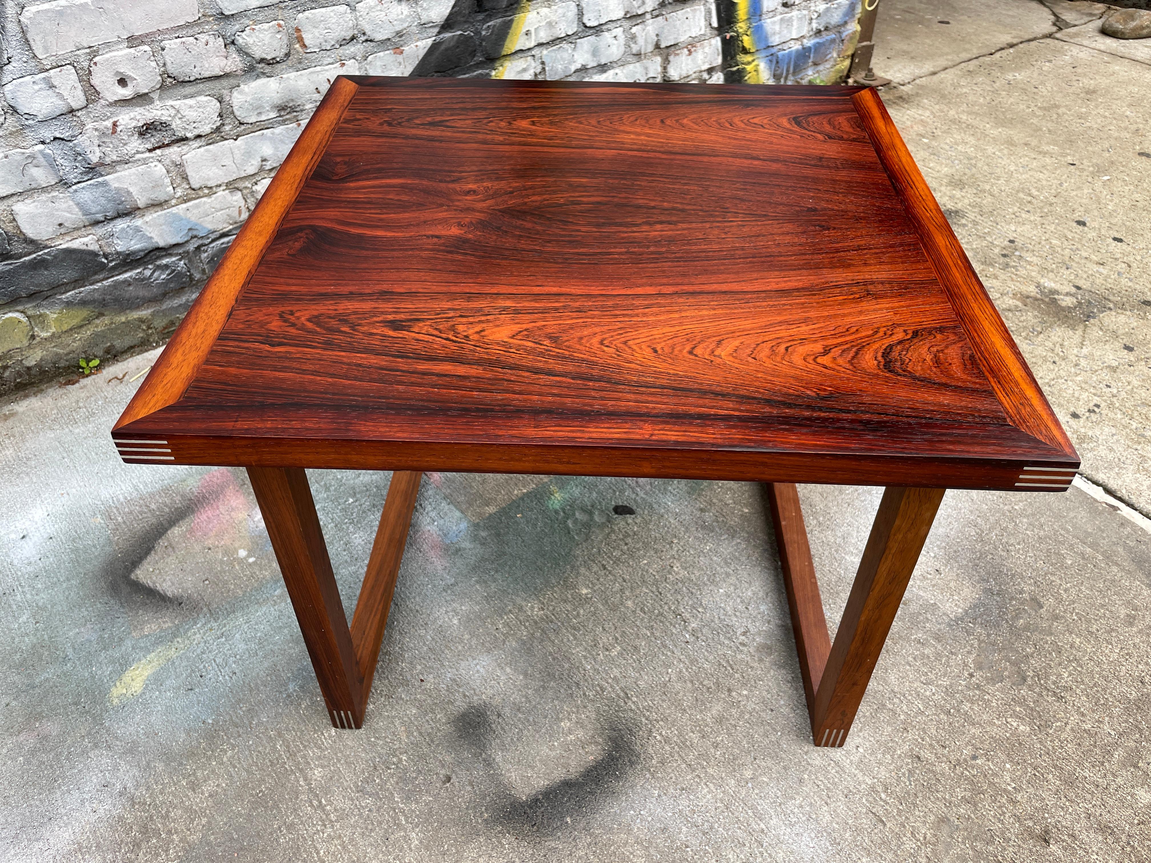 Beautiful Solid rosewood side table table. Amazing aluminum jointery on all joints very sturdy and great design. Rosewood Rud Thygesen for Heltborg Mobler Danish Modern Coffee Table,
Located in Brooklyn NYC. No Labels or MFG
