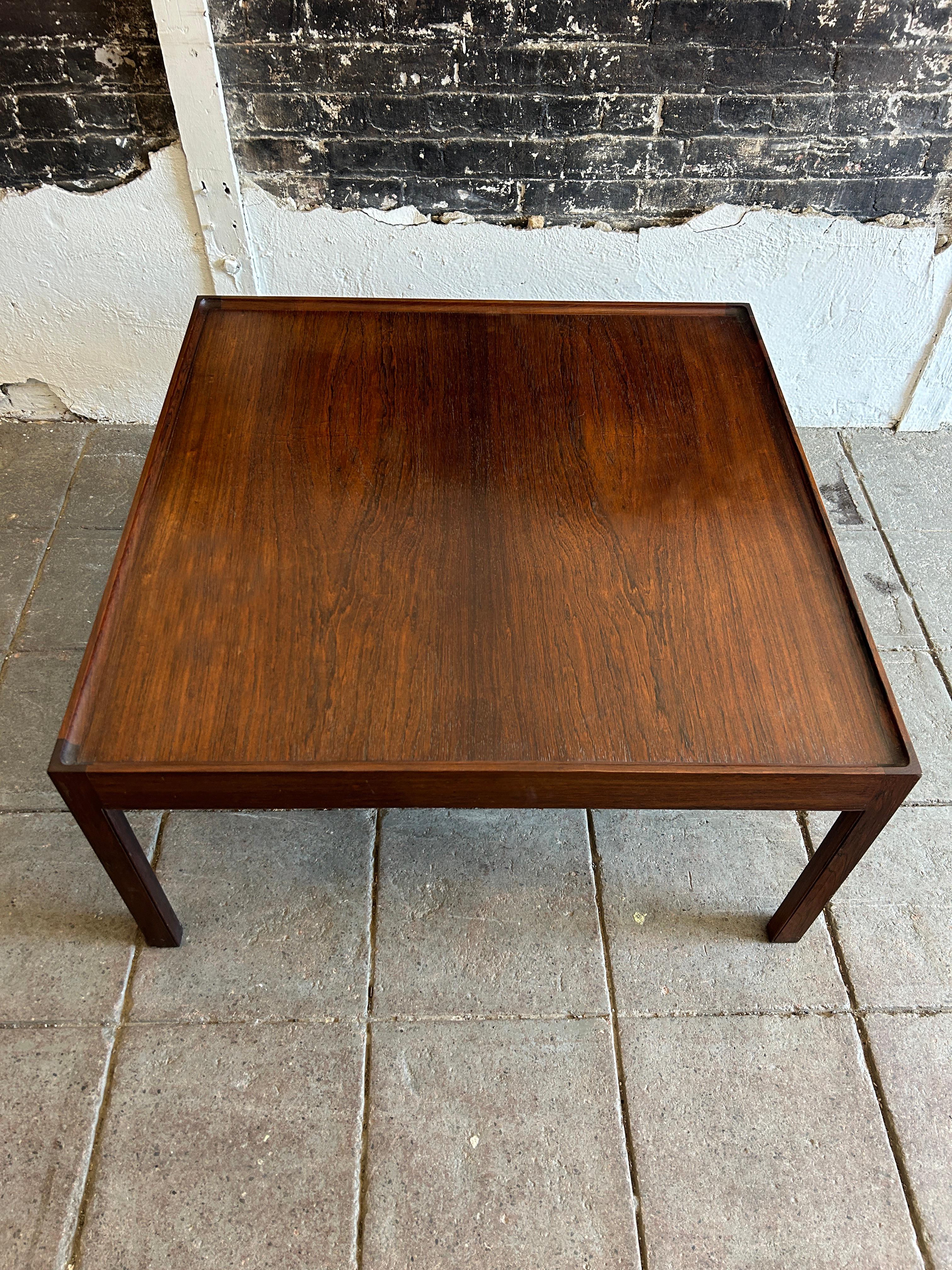 Mid century Danish modern Rosewood square coffee table with recessed lip. Designed by Erik Christian Sorensen for Bo-Ex. Very beautiful high quality woodworking. Beautiful Rosewood grain all around. Made in Denmark located in Brooklyn NYC.

Measures