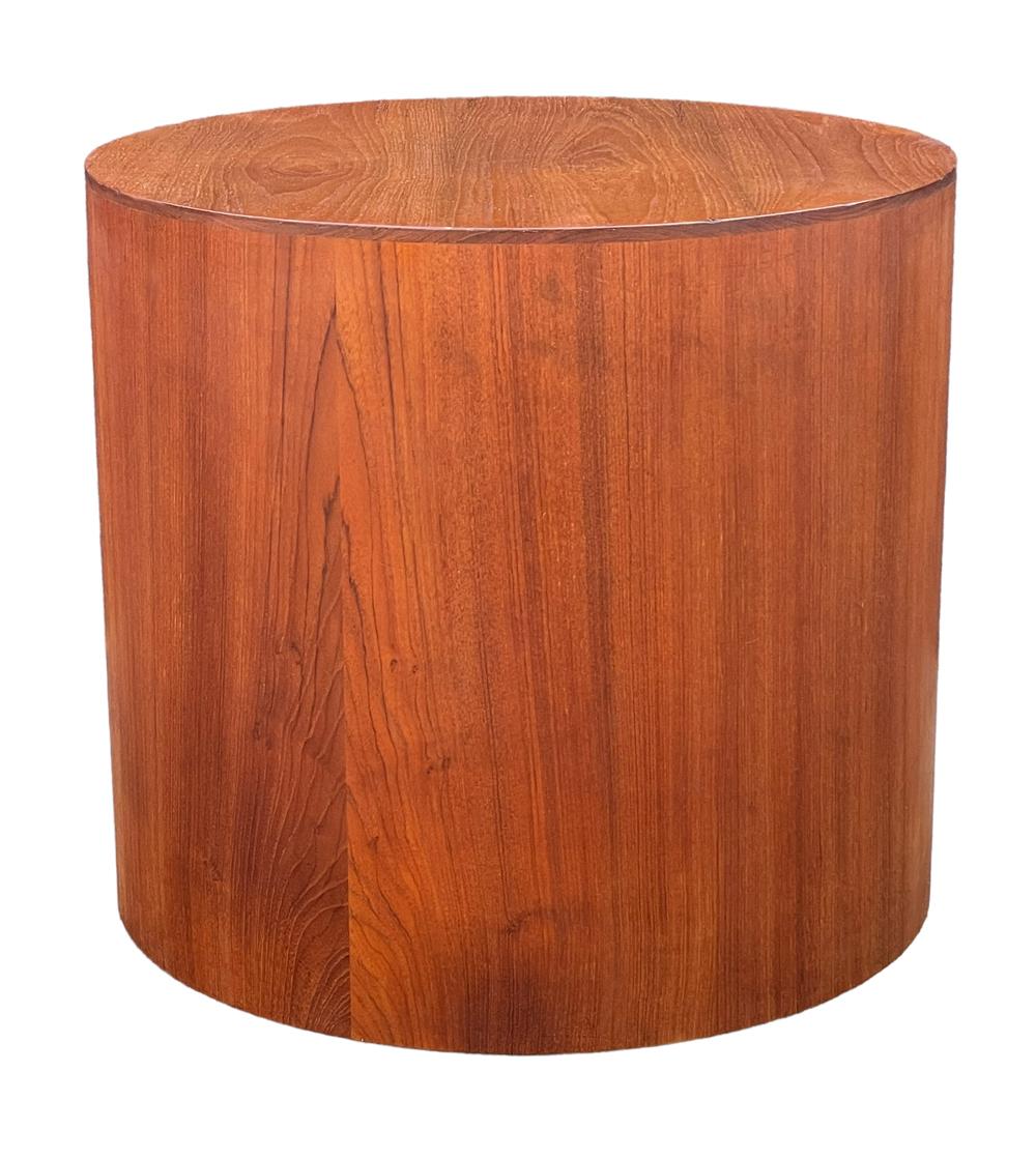 A simple clean modern drum table from Denmark circa 1960's. It features beautiful grained teak wood construction. Great versatile piece in very good condition. 