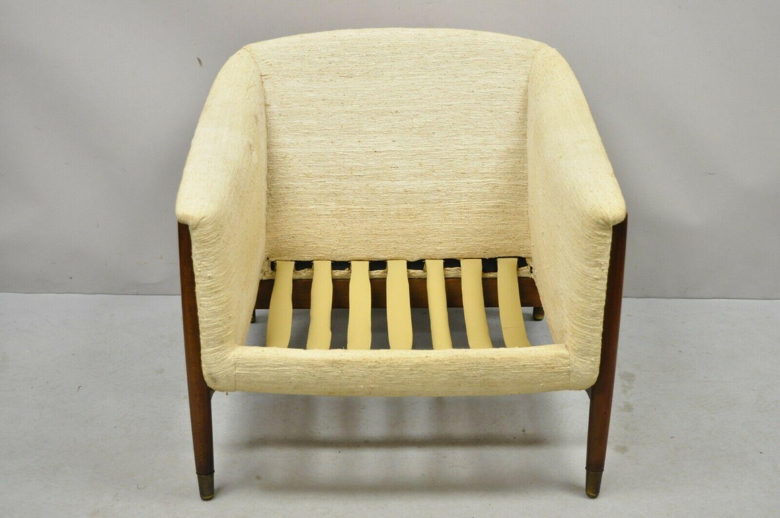Mid-century Danish Modern sculpted walnut barrel back club lounge chair. Item features a solid wood frame, beautiful wood grain, tapered legs, very nice vintage item, sleek sculptural form. Circa mid-20th century. Measurements: 25