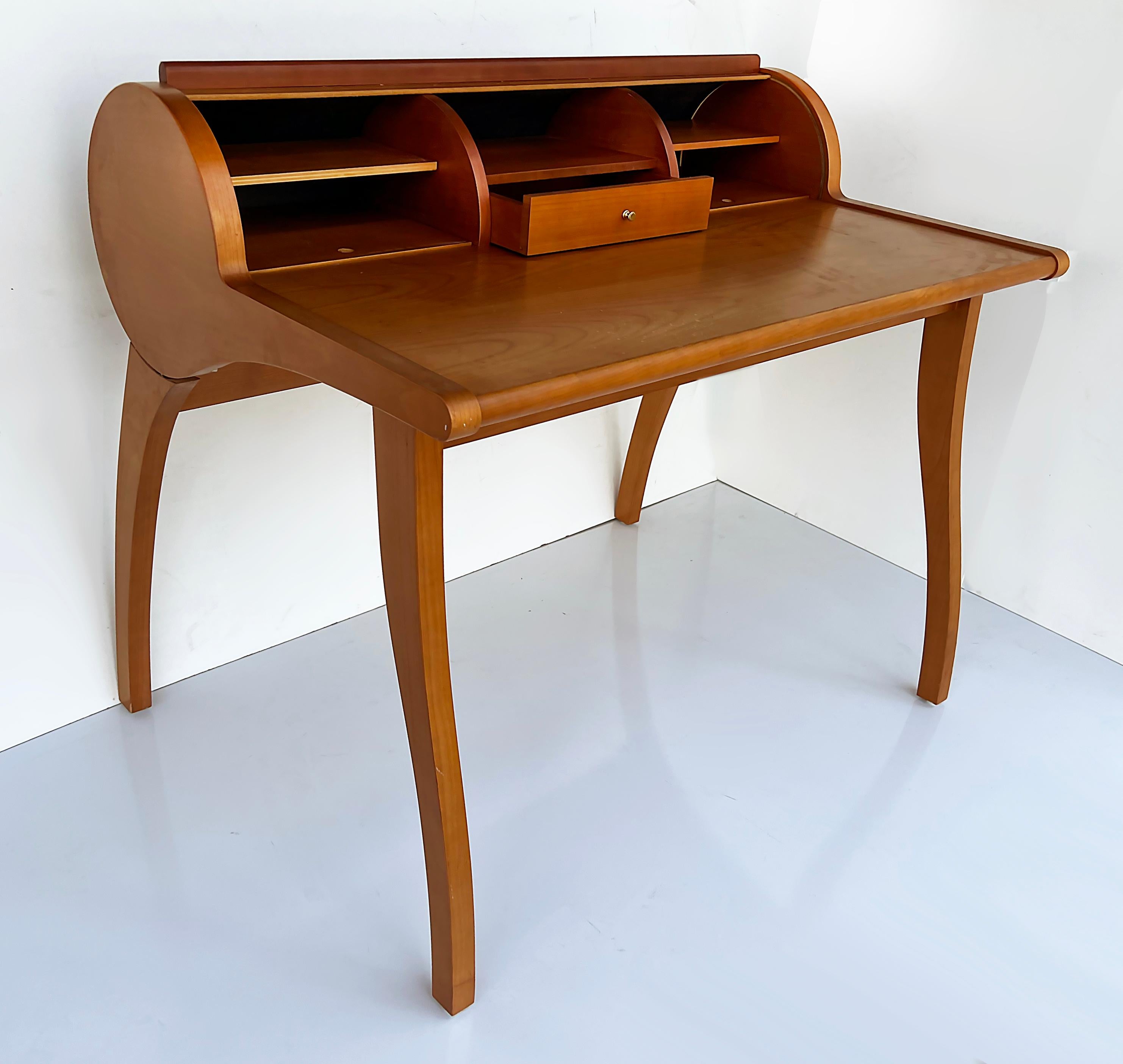 Mid-Century Danish Modern sculptural teak roll-top desk

Offered for sale is a Mid-century Danish Modern roll-top desk created with a great sculptural form. The small desk has a drawer and two hidden compartments with cubby-hole storage as well as