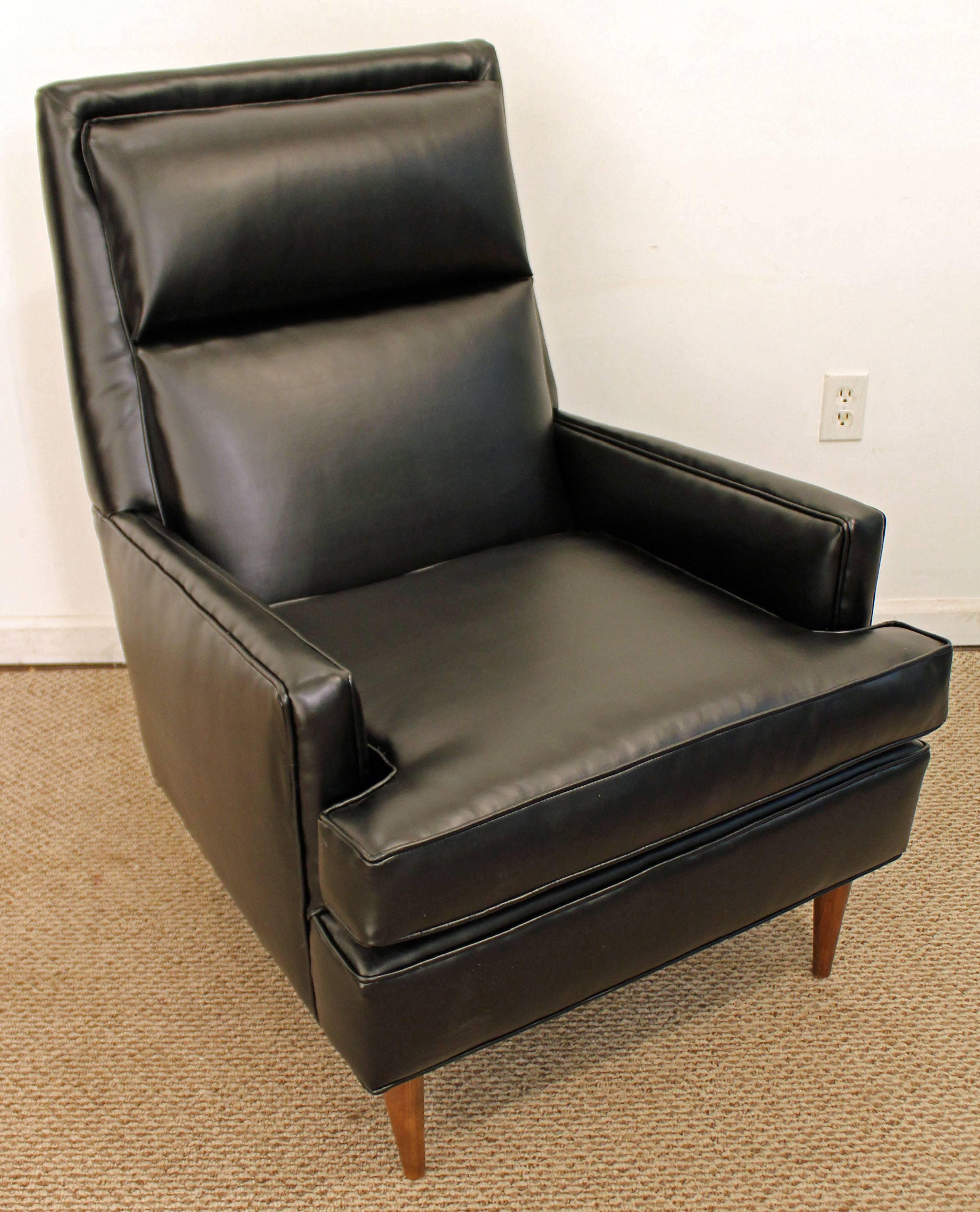 This chair has been completely reupholstered with bonded synthetic leather. 

Approximate dimensions:
28.25