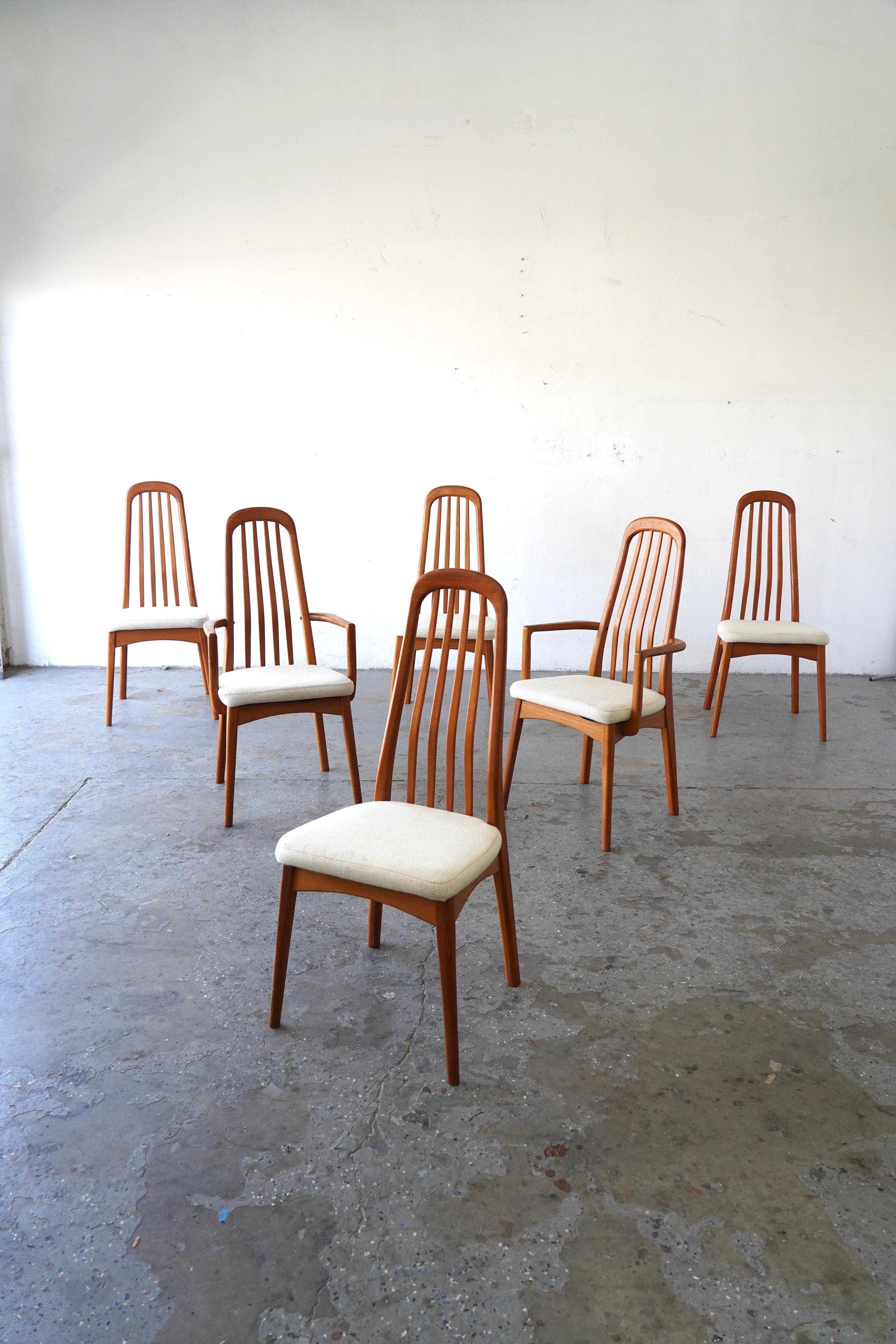 A refined set of six Danish Modern dining chairs designed by Benny Linden, crafted in solid teak with elegant sculptural high backs and gently contoured lines. This set includes two armchairs (captain’s chairs) and four side chairs, offering both