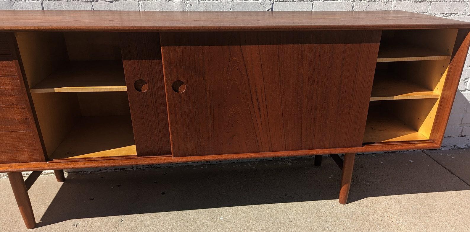 Mid Century Danish Modern Sideboard by Kurt Ostervig for KP Mobler
 
Above average vintage condition and structurally sound. Has some expected slight finish wear and scratching. Has a couple small dings on edges. Top has been refinished. There is a