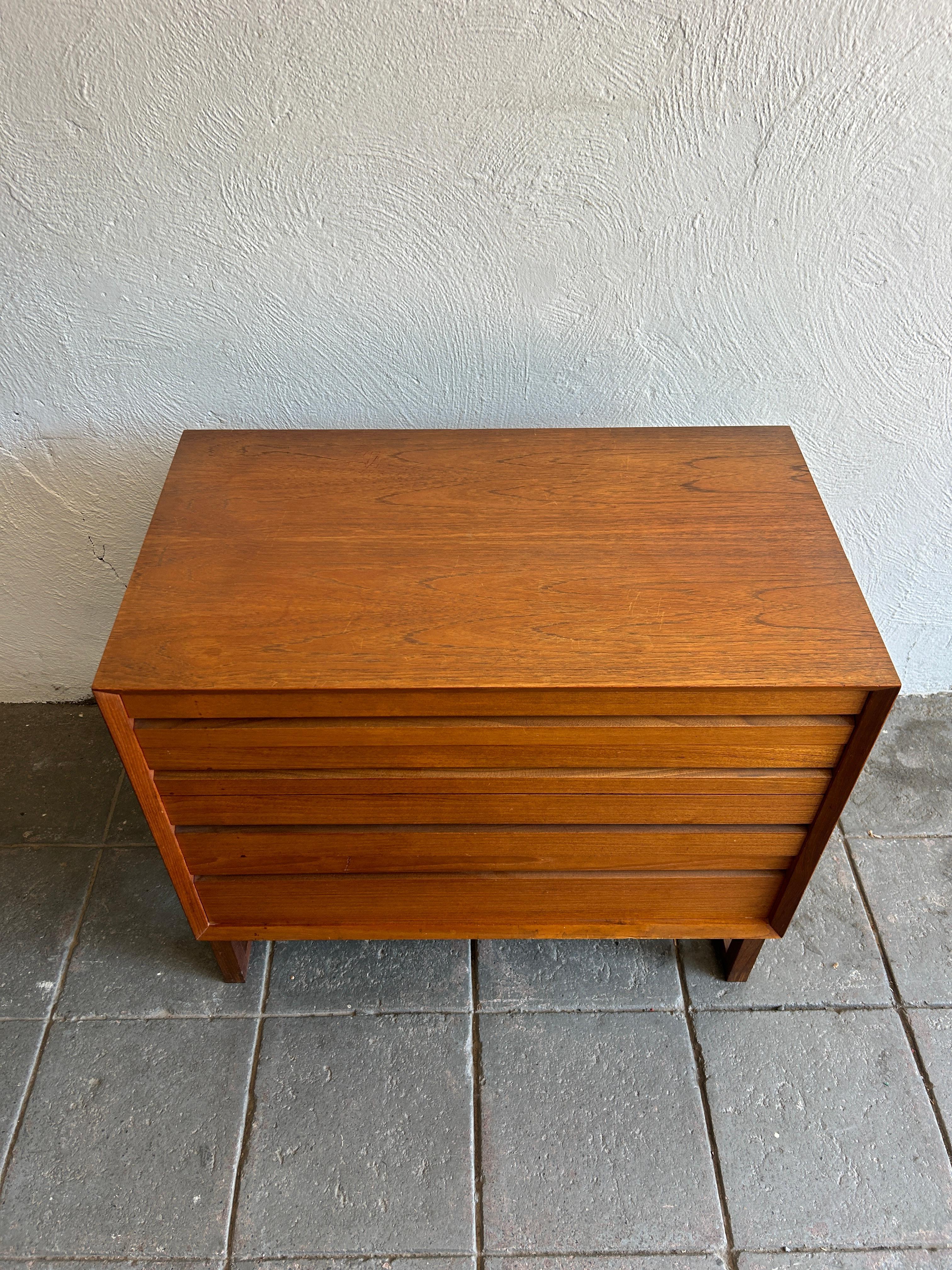 Mid century danish modern small 4 drawer low teak dresser on base freestanding by Poul Cadovius. Very nice construction with Solid Birch drawers that are super clean and slide smooth. Made in Denmark. Located in Brooklyn NYC.

