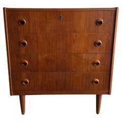 The Moderns modern small 4 drawer low teak dresser on legs