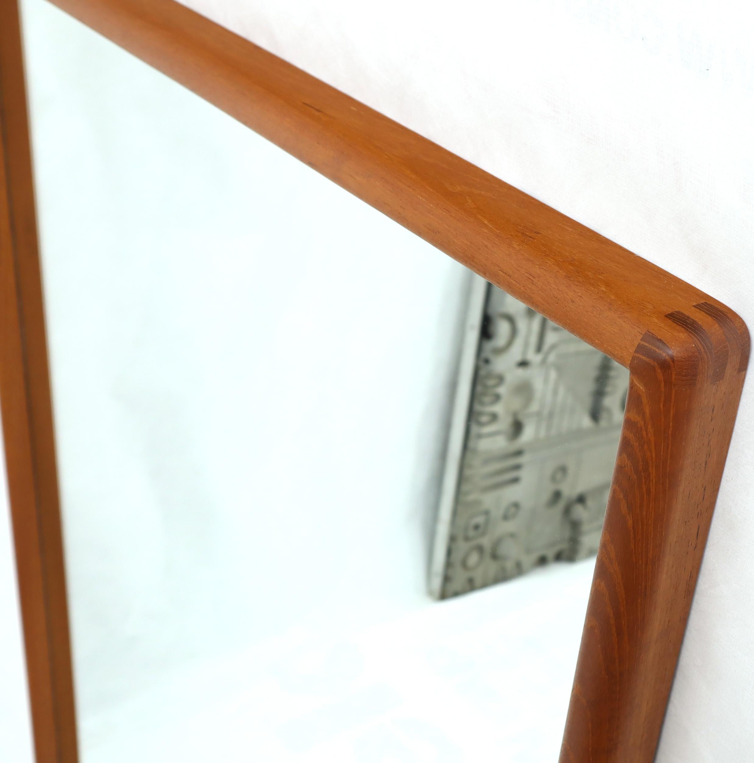 Midcentury solid teak frame rectangular wall mirror.