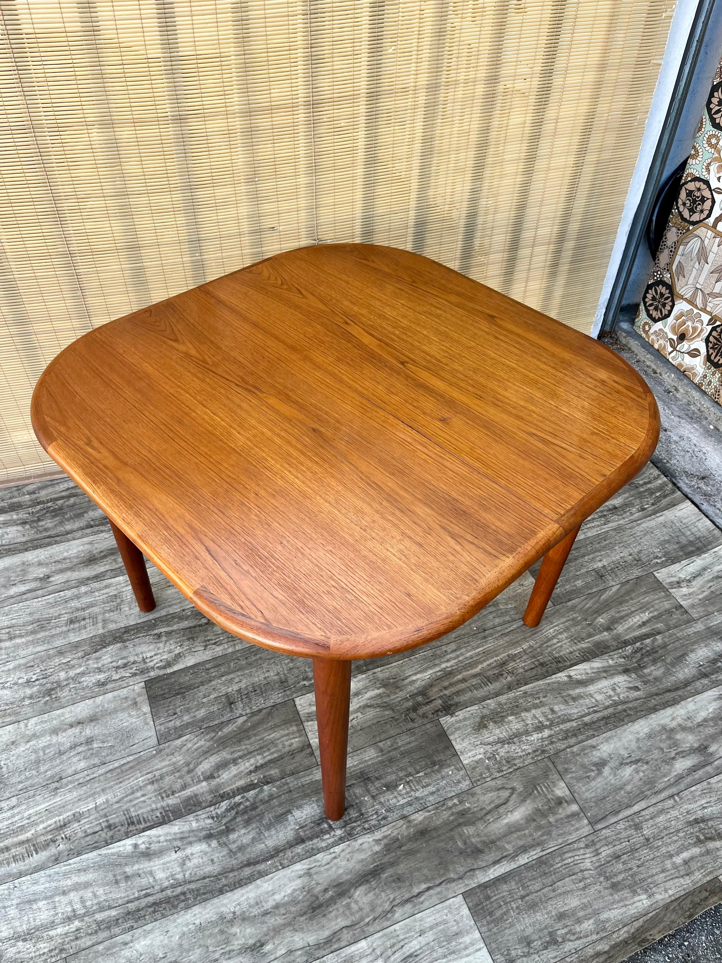 Scandinavian Modern Mid Century Danish Modern Style Teak Extendable Dining Table. Circa 1970s