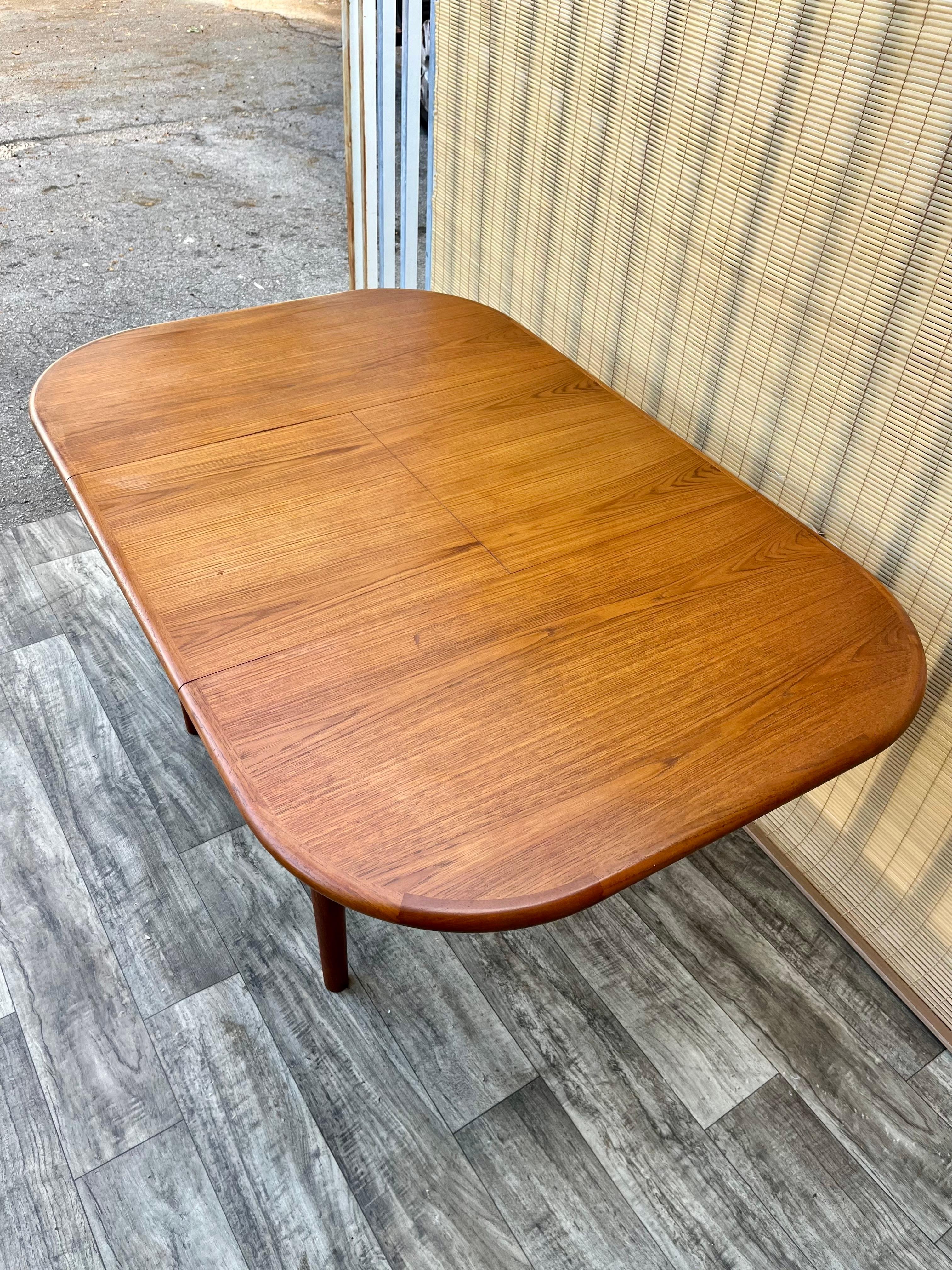 Veneer Mid Century Danish Modern Style Teak Extendable Dining Table. Circa 1970s