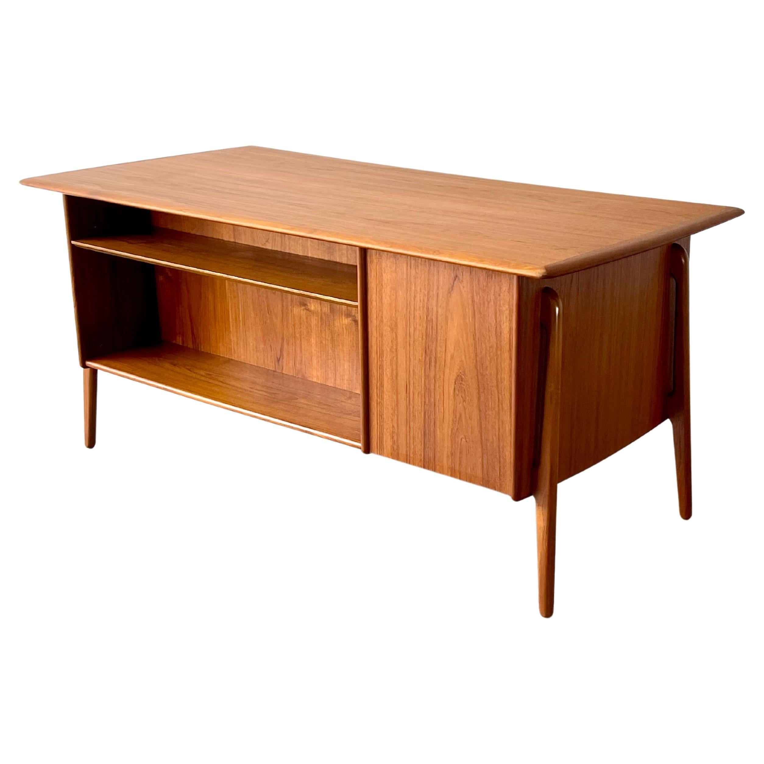 Mid-Century Danish Modern Svend Madsen teak executive bookcase desk

Rare and beautiful Svend Madsen designed teak executive desk with book case on public side, file drawer and slide out (slide out is perfect for a laptop) return on left and three