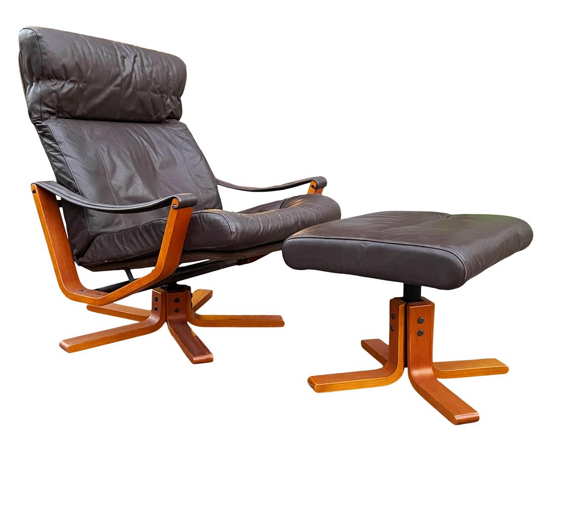 A great vintage Scandinavian lounge chair and ottoman set circa 1970's. The set features a swiveling base chair, reclining mechanism, and chocolate brown leather cushions. Very well cared for and ready use.