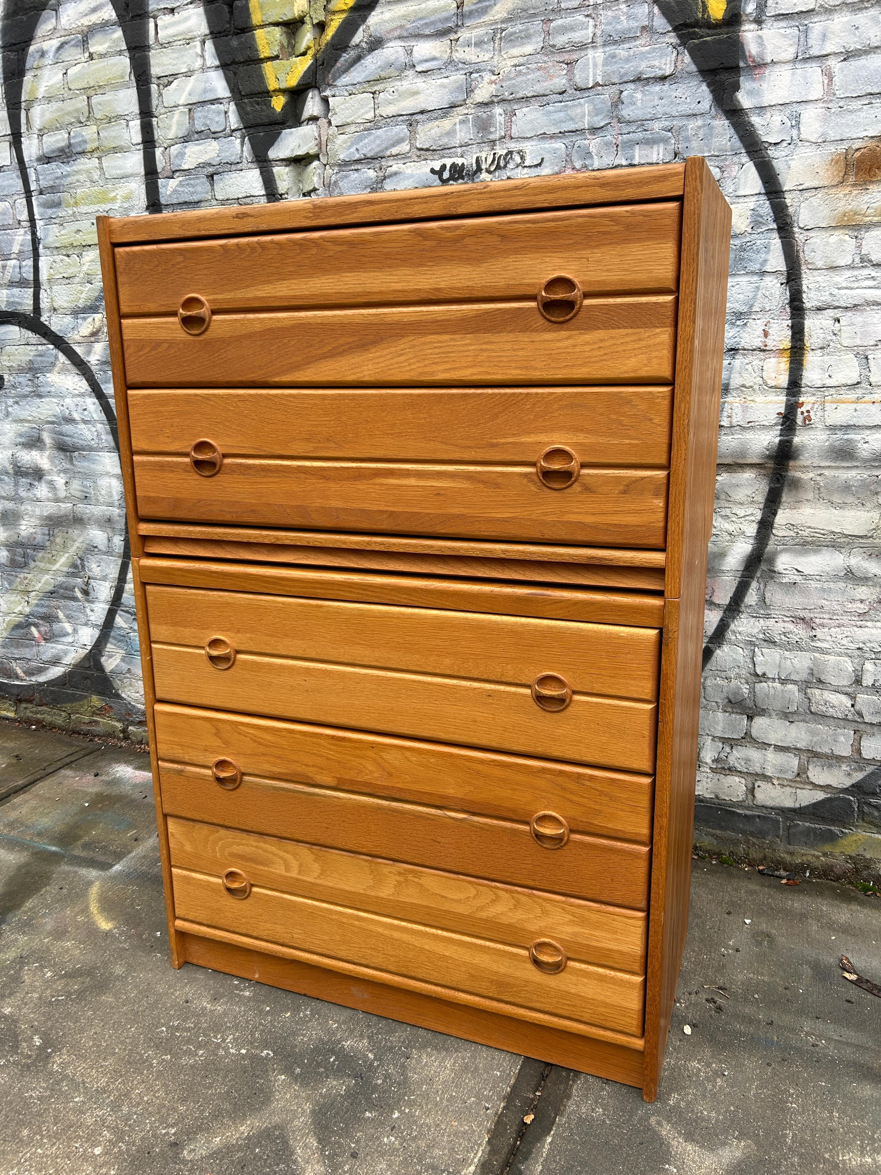 Beautiful tall mid century Danish modern Solid Oak five-drawer dresser. Great simple modular design and great vintage condition - clean inside and out. Drawers slide smooth on metal glides. Great light blonde oak wood grain with solid oak round
