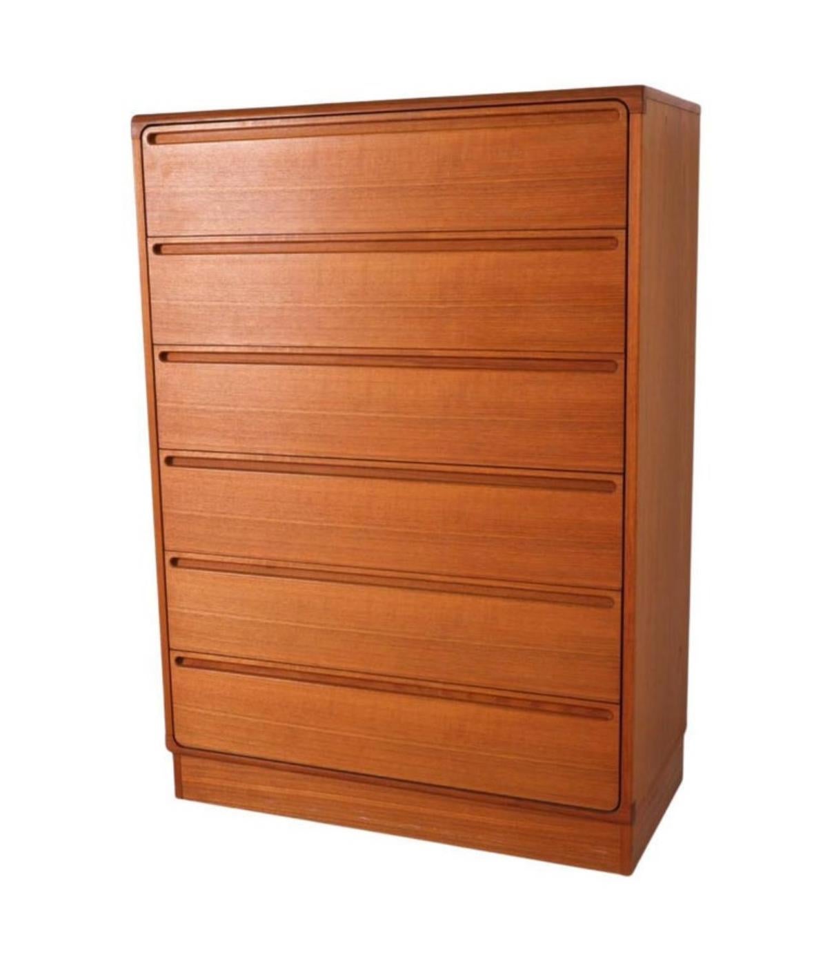 Mid century danish modern tall teak dresser by Nils Johnson. Beautiful tall 6 drawer teak dresser with high quality woodworking. Drawers have glides with stops. Curved drawer fronts with inset handles. Labeled -  Designed by Nils Johnsson made by