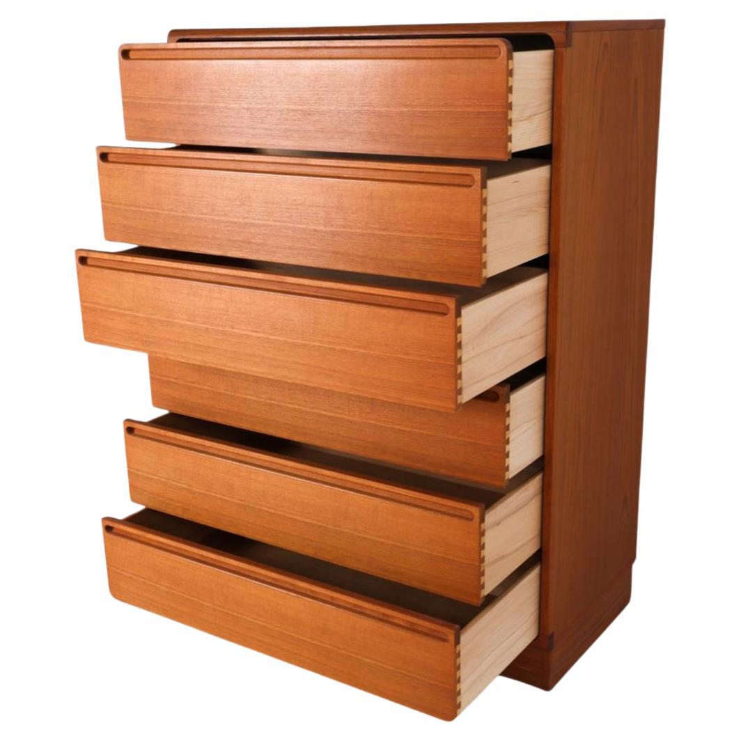 Danish Mid century danish modern tall teak dresser by Nils Johnson