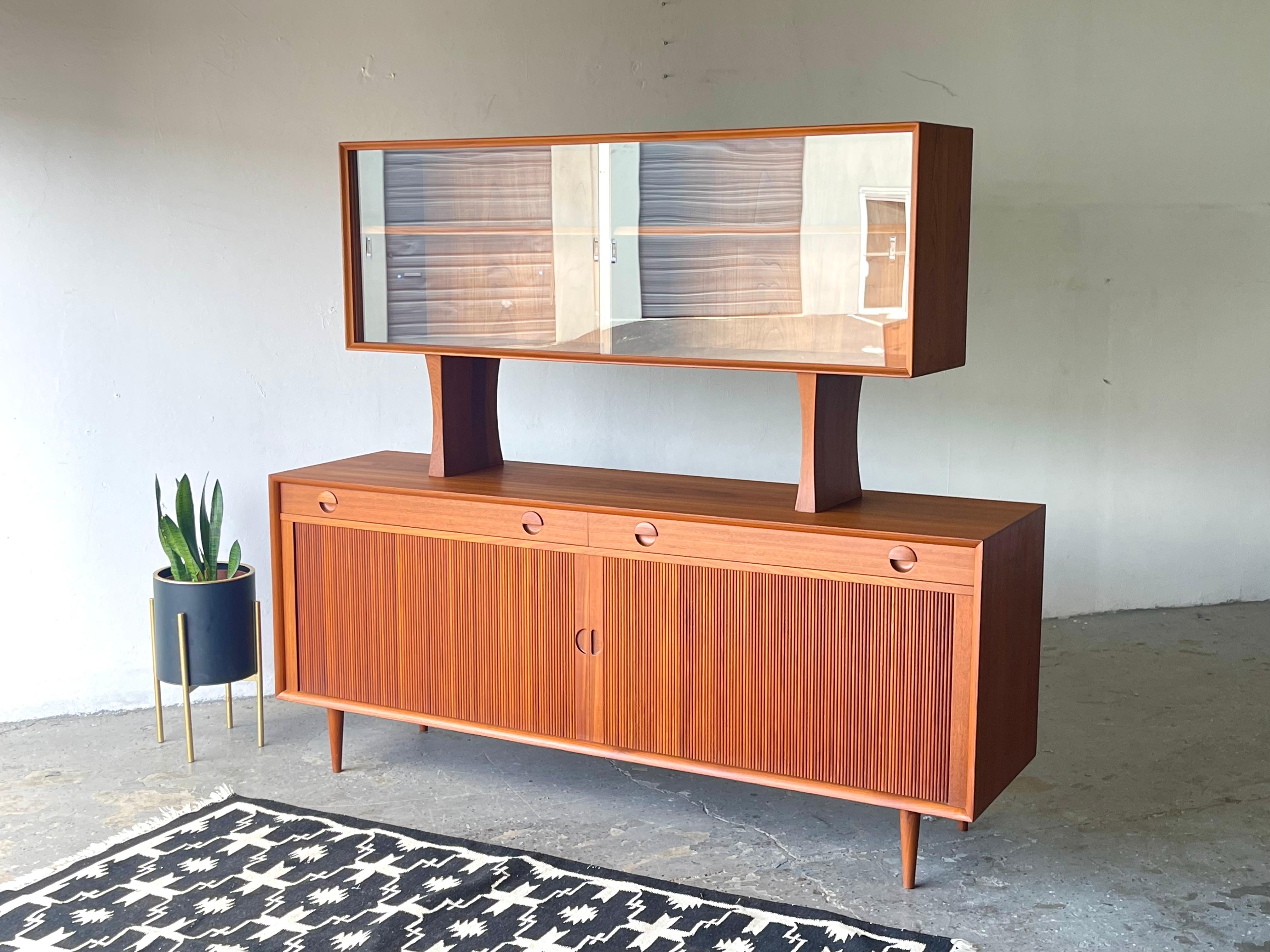 This credenza, known as the 'Model 41', was Originally purchased in 1962. Designed by Grete Jalk, this superb mid-century sideboard / credenza, is an iconic piece, finished in beautiful, book-matched, teak veneers, features two narrow drawers (each