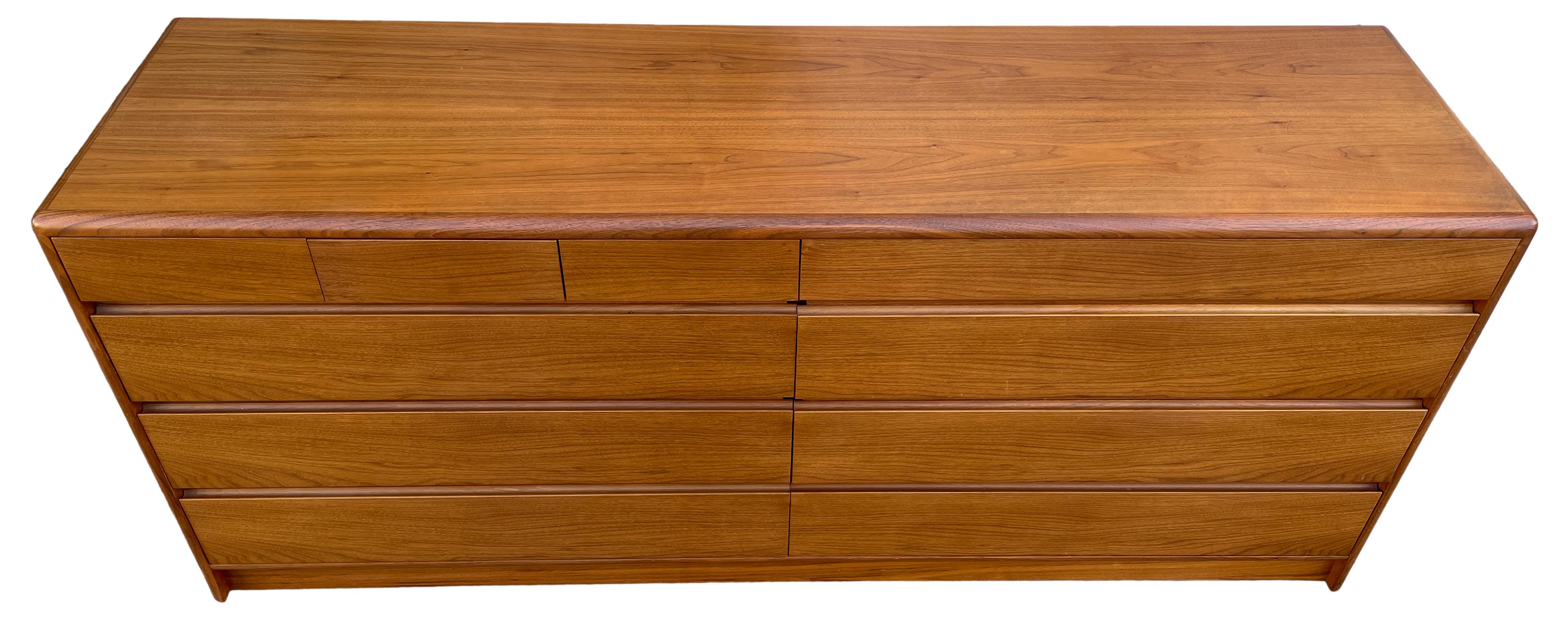 Beautiful mid-century Danish modern teak 10 drawer dresser Credenza by Nordisk Andels-Eksport. Great simple design and great vintage condition - clean inside and out. Drawers slide smooth with dovetail construction. Has 3 small top drawers on left