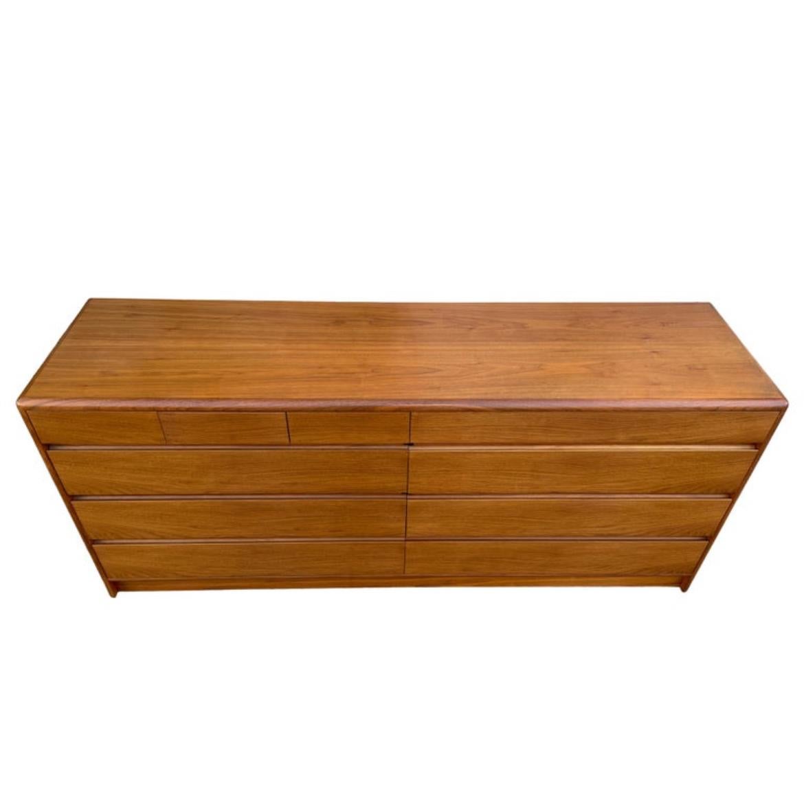 Beautiful mid-century Danish modern teak 10 drawer dresser Credenza by Nordisk Andels-Eksport. Great simple design and great vintage condition - clean inside and out. Drawers slide smooth with dovetail construction. Has 3 small top drawers on left