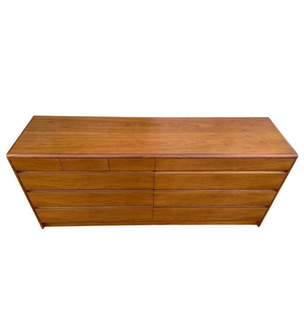 Beautiful mid-century Danish modern teak 10 drawer dresser Credenza by Nordisk Andels-Eksport. Great simple design and great vintage condition - clean inside and out. Drawers slide smooth with dovetail construction. Has 3 small top drawers on left