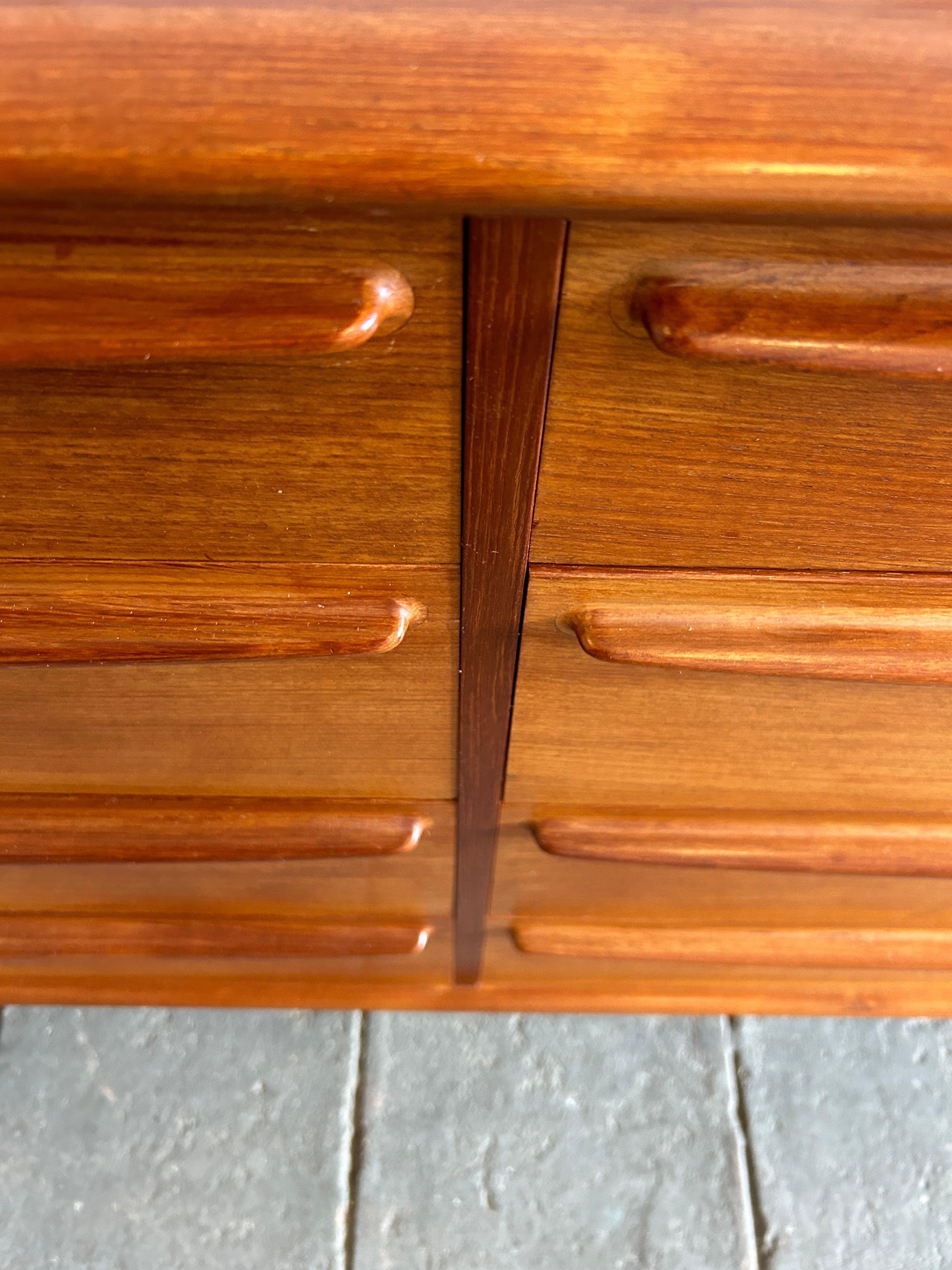 Mid-20th Century Mid century danish modern teak 8 drawer dresser with sculpted handles  For Sale