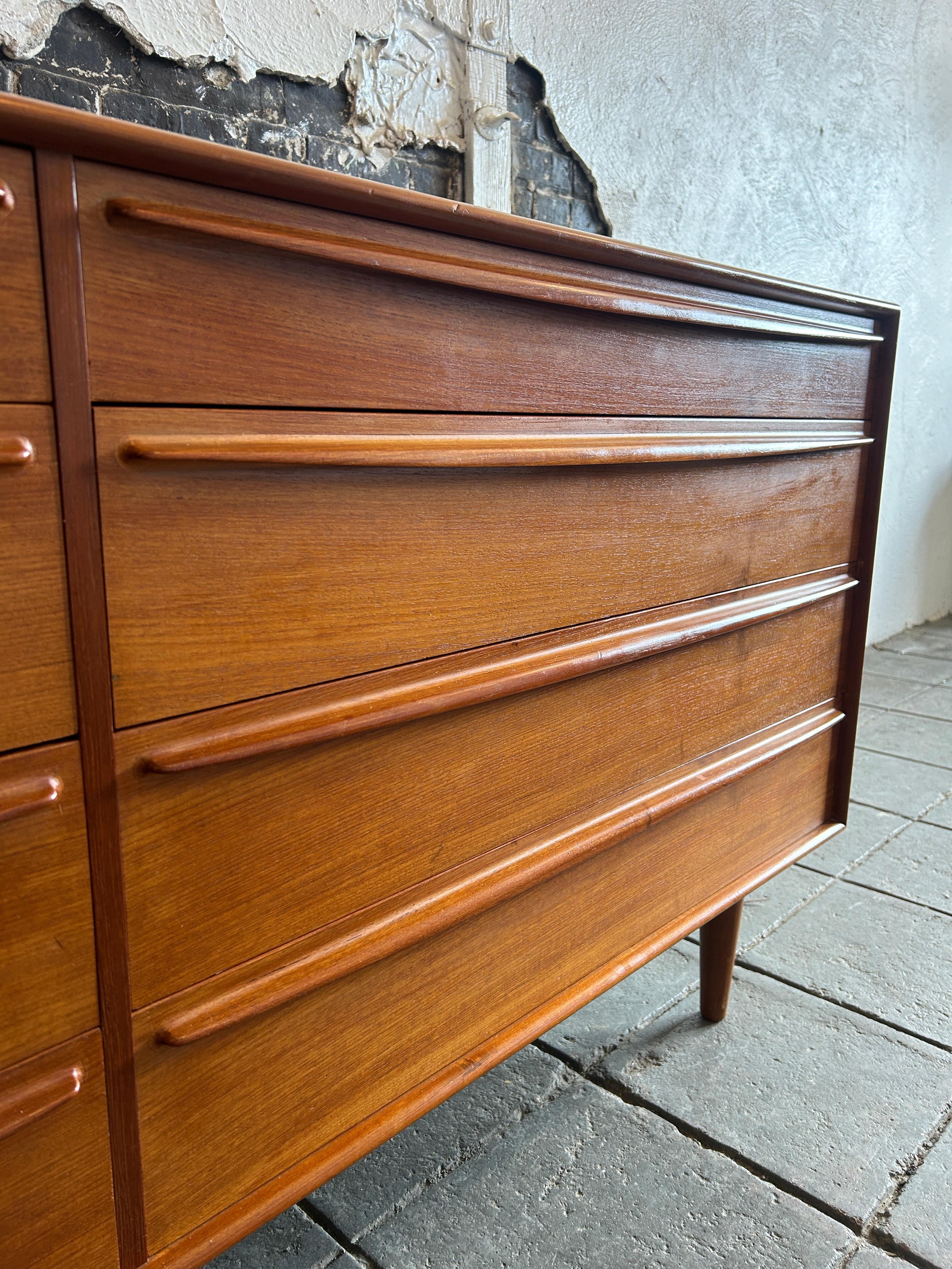 Teak Mid century danish modern teak 8 drawer dresser with sculpted handles  For Sale