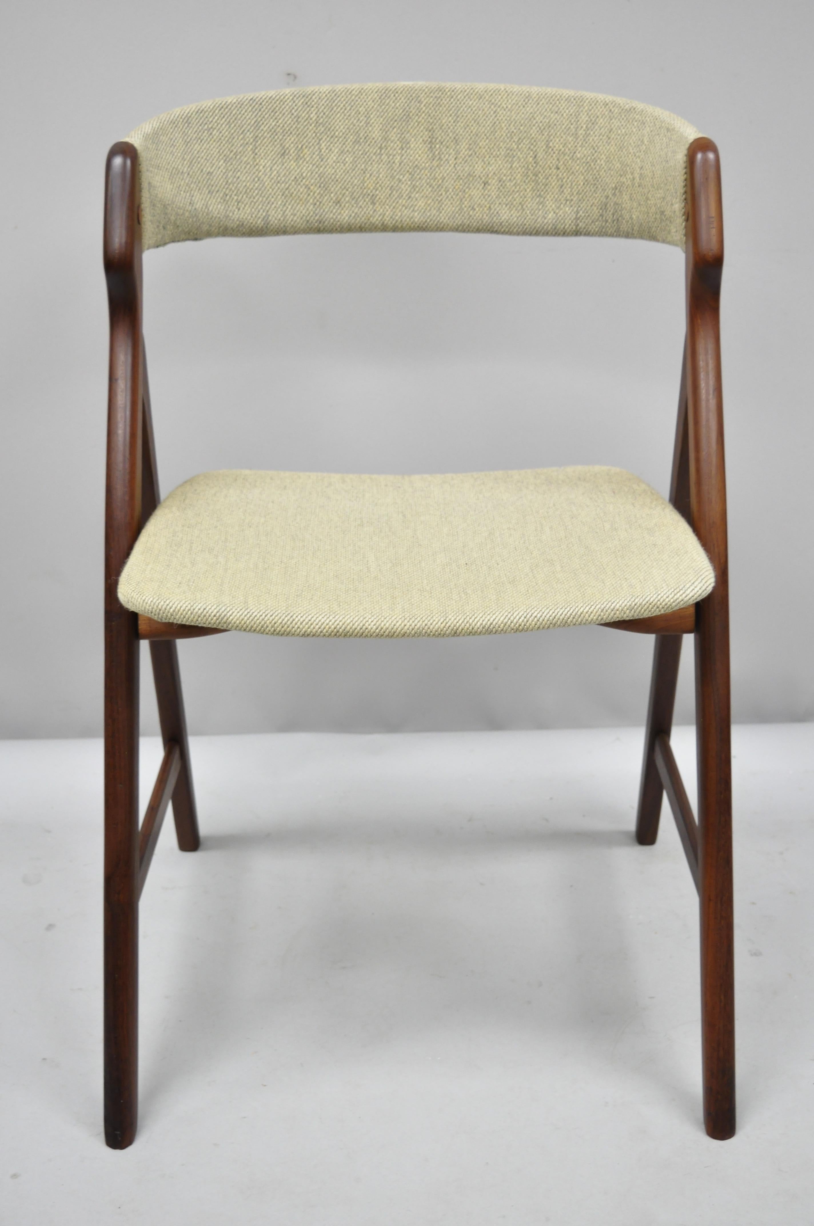 Midcentury Danish modern teak A-Frame dining chair by T.H. Harlev Farstrup. Curved back, A-frame design, solid teak wood construction, beautiful wood grain, tapered legs, clean modernist lines, designed by T.H. Harlev Farstrup, circa 1960.