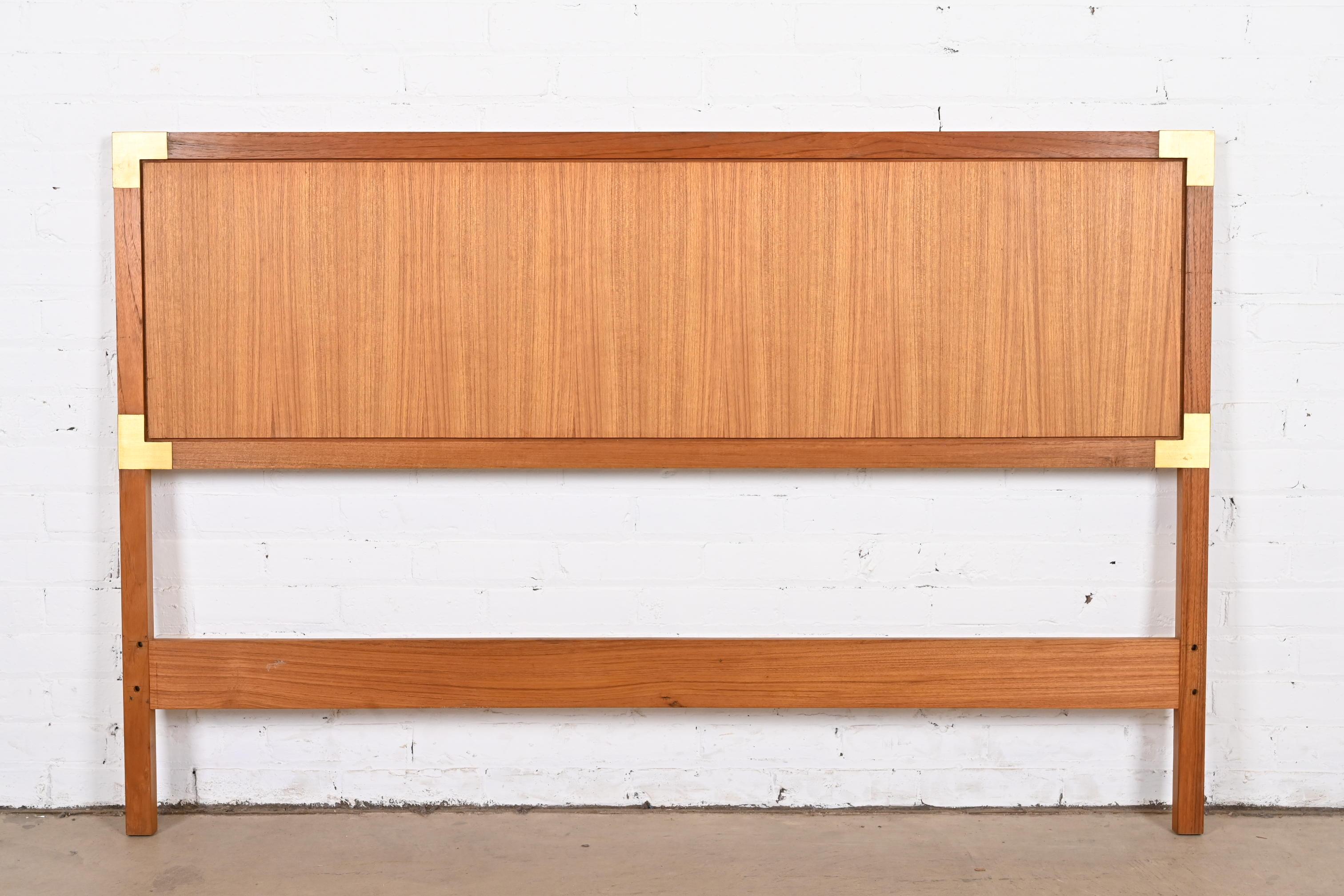 A beautiful midcentury Danish Modern Campaign style queen size headboard

Denmark, circa 1970s

Teak, with brass accents.

Measures: 60