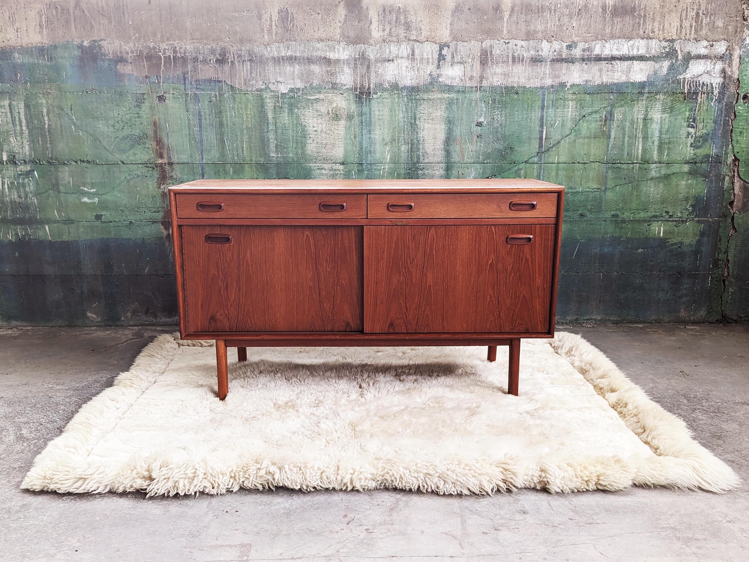 Fantastic, minimalist Original Danish Teak Mid Century Credenza piece that is just the perfect size for a Dining room, living room for a TV, or a bedroom. This piece works everywhere.  It is timeless and beautiful.  Comes with two parts, a top and a