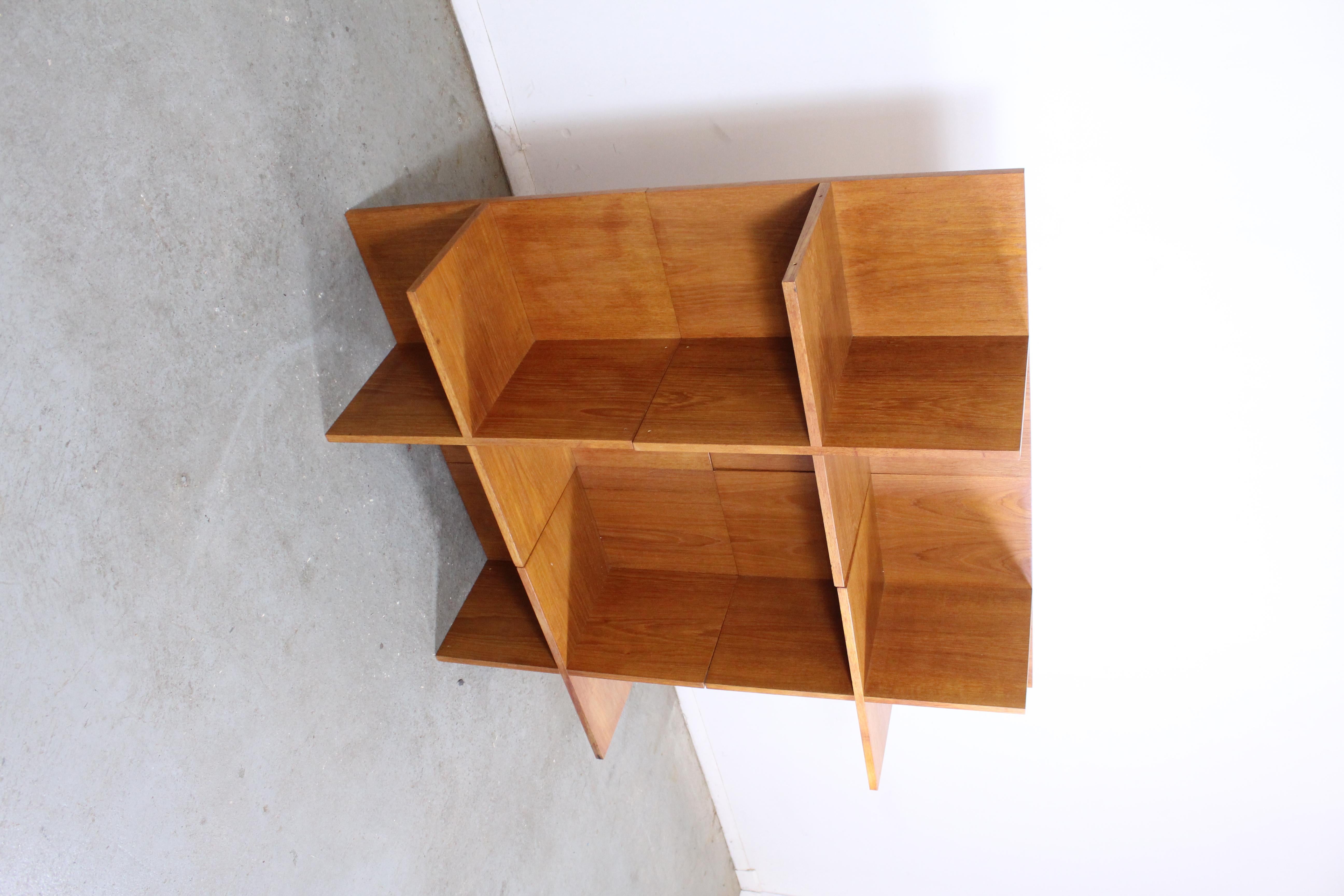 Danish modern teak modular shelving unit 

Offered is a Danish modern teak shelving unit. It has four shelving sections which can be pulled apart with ease and reorganized. It is structurally sound with some minor fading and scratches in the wood.