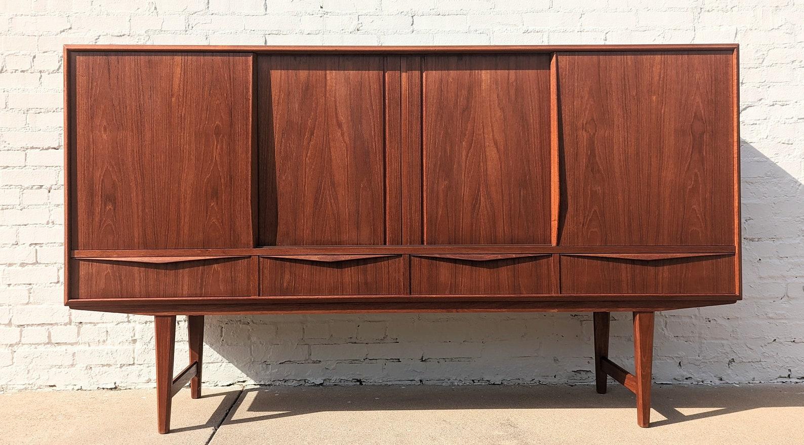 Mid Century Danish Modern Teak Cabinet

Above average vintage condition and structurally sound. Has some expected slight finish wear and scratching. Has a couple edge dings. Beautifully crafted. Outdoor listing pictures might appear slightly darker