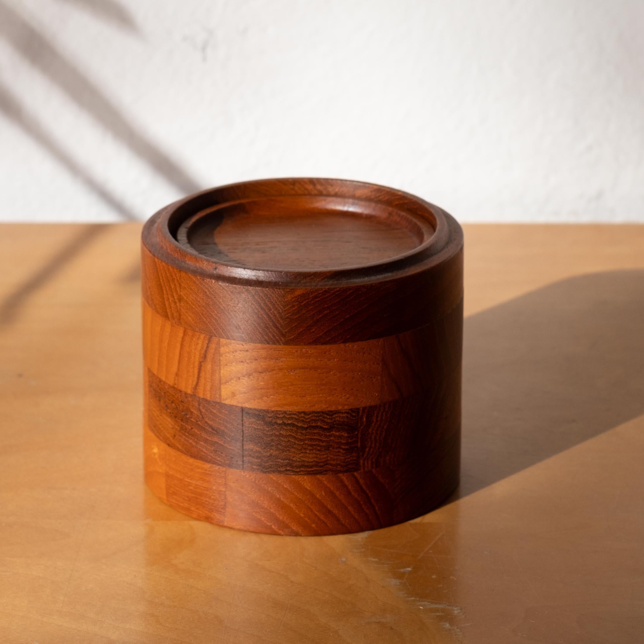 Danish modern solid teak coaster set. Set of six coasters in a staved teak canister. Beautifully made. Retains original made in Denmark label.